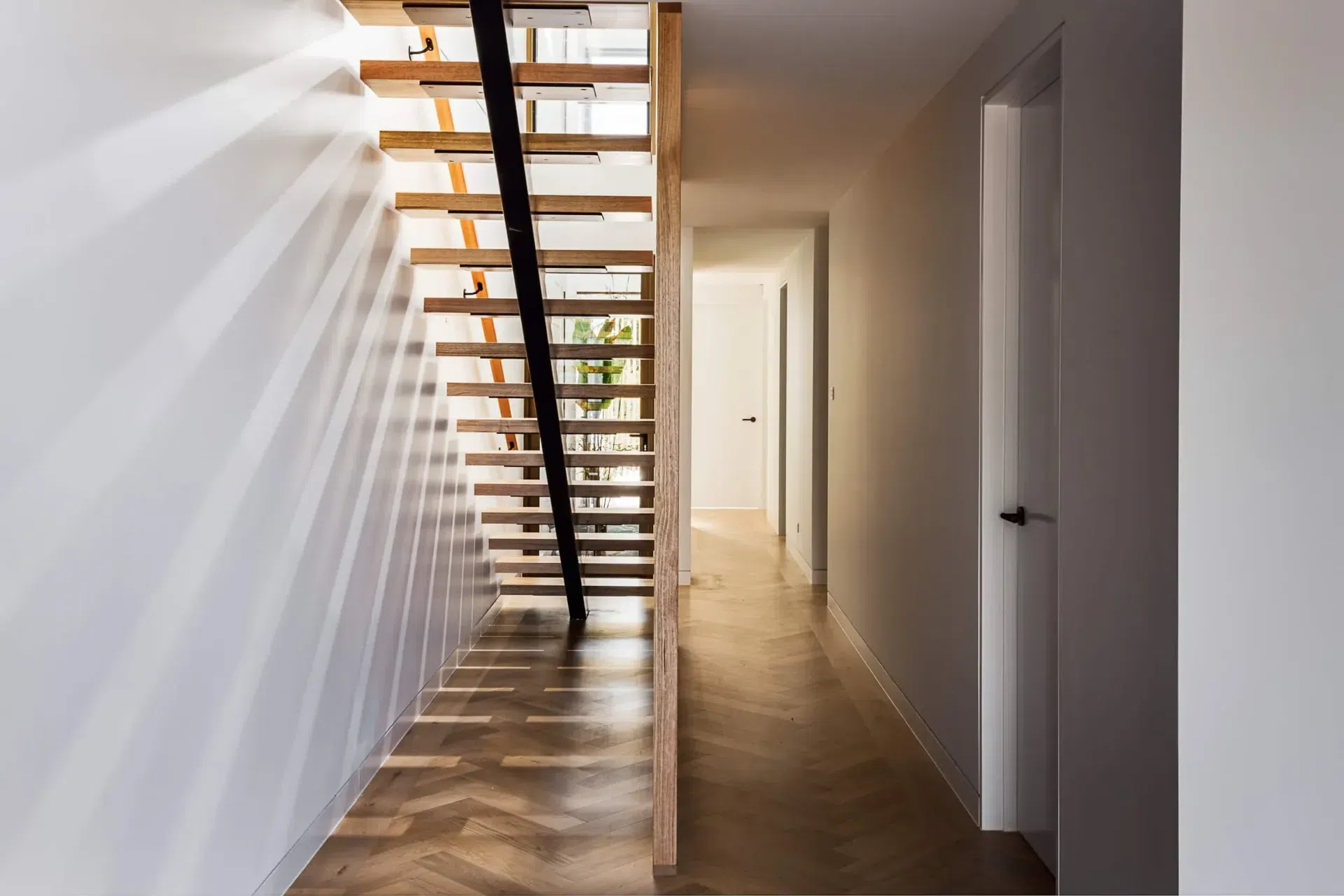 obrien-duplex-bulli-timber-staircase-herringbone-shadows-light-and-lines.webp