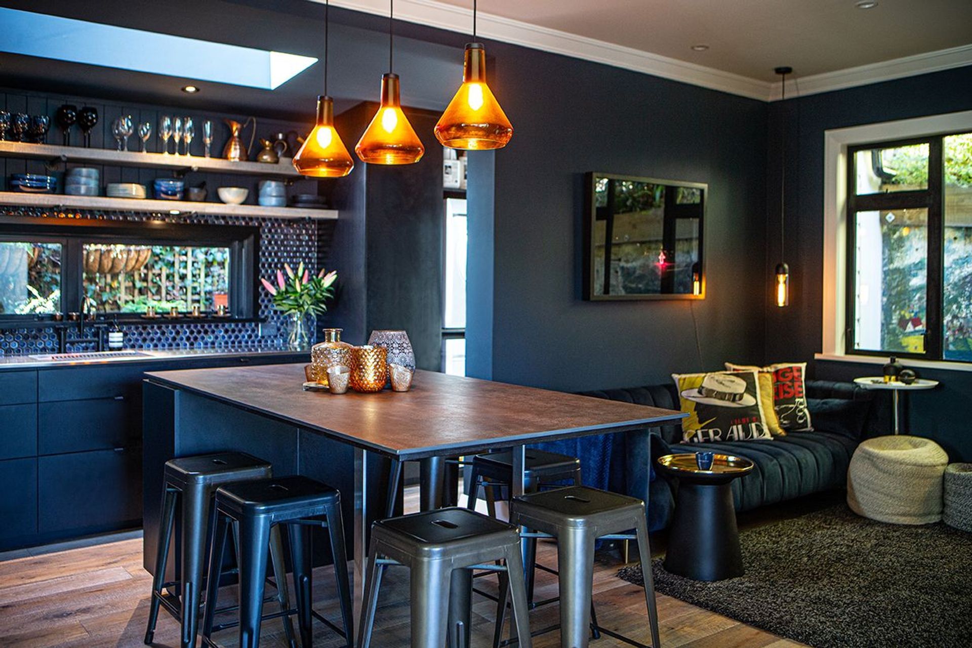 Moody hues in the kitchen design and living spaces.