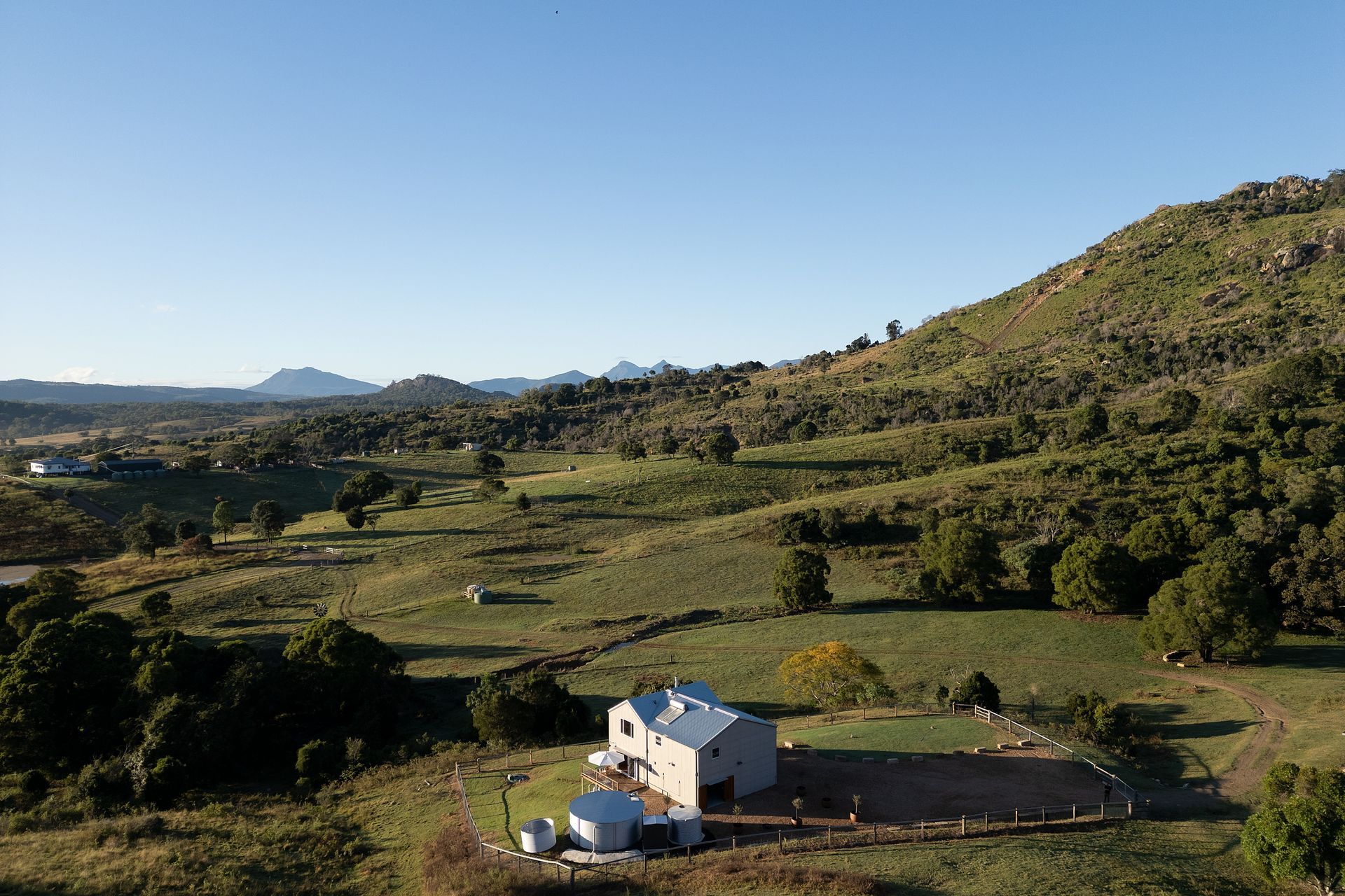 Set in the lee of Mount Alford, this off-grid home reinterprets the iconic Australian farm shed through the lens of contemporary, high-performance design.