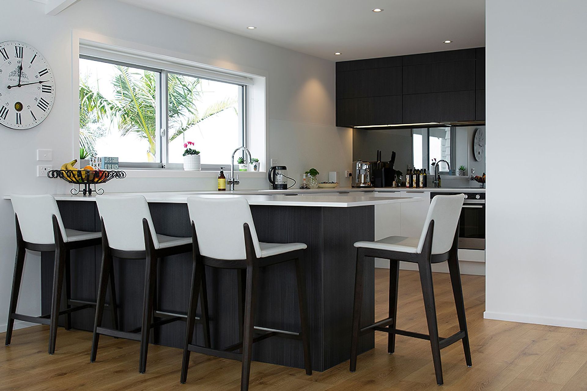 Milan profile in Hacienda Black - Woodgrain. Design by Modern Kitchens. Photography by Liam Dijk.