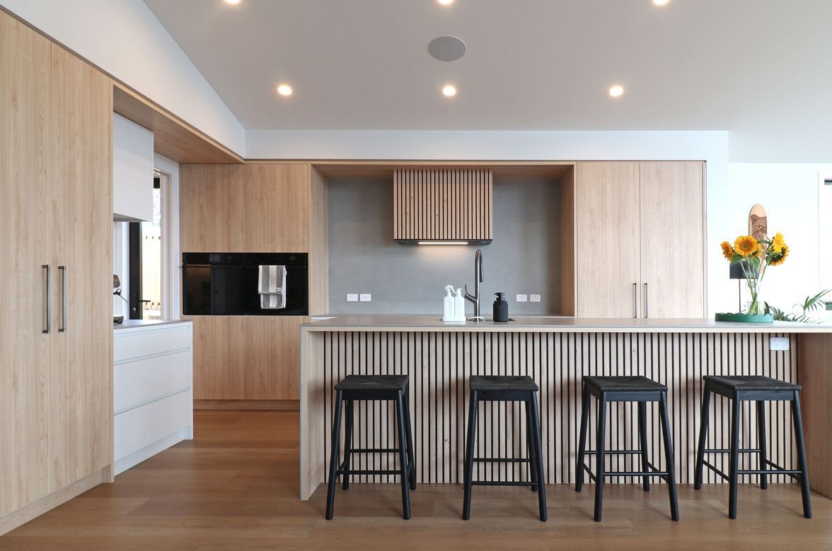 Elevated Elegance: A Family Kitchen Framing Harbour Views