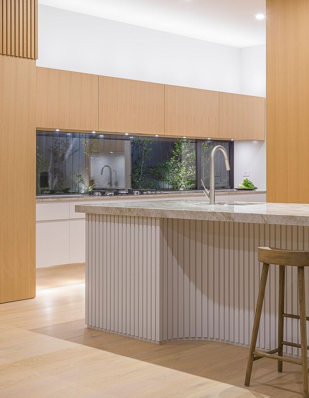 Designed in 2019 before battened sheets became mainstream, each ‘pleat’ is carefully predetermined and dimensioned to read as evenly spaced even within the internal curvature. Like a perfectly hemmed garment, the battens just lightly skirt the floor.