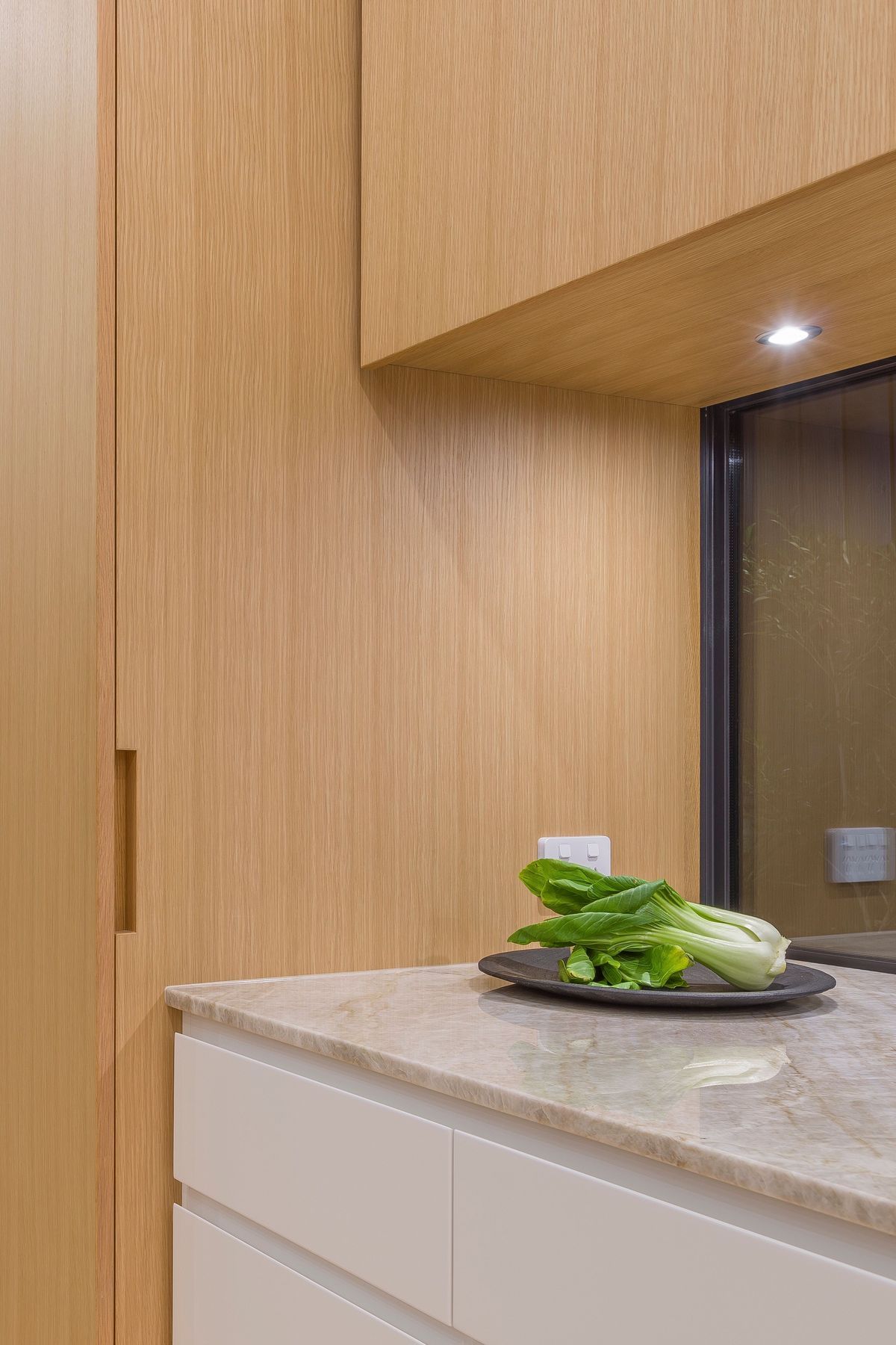 For the home planning centre and tall ‘breakfast pantry’, custom oak recessed handles are handcrafted with precision to fold seamlessly into the veneer door faces and side.