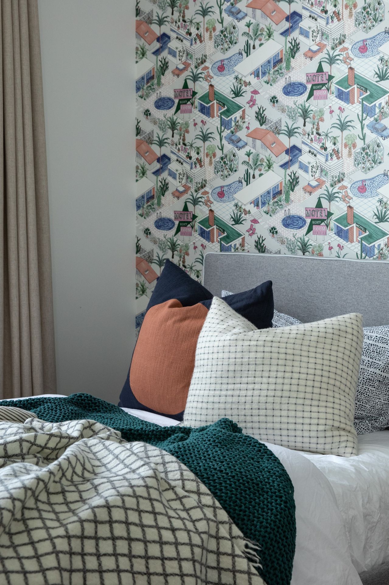 The children's bedroom introduces a playful layer to the home with Palm Springs-inspired wallpaper, crisp white walls and soft linen curtains. Natural light and carefully selected finishes create a calm and joyful retreat.