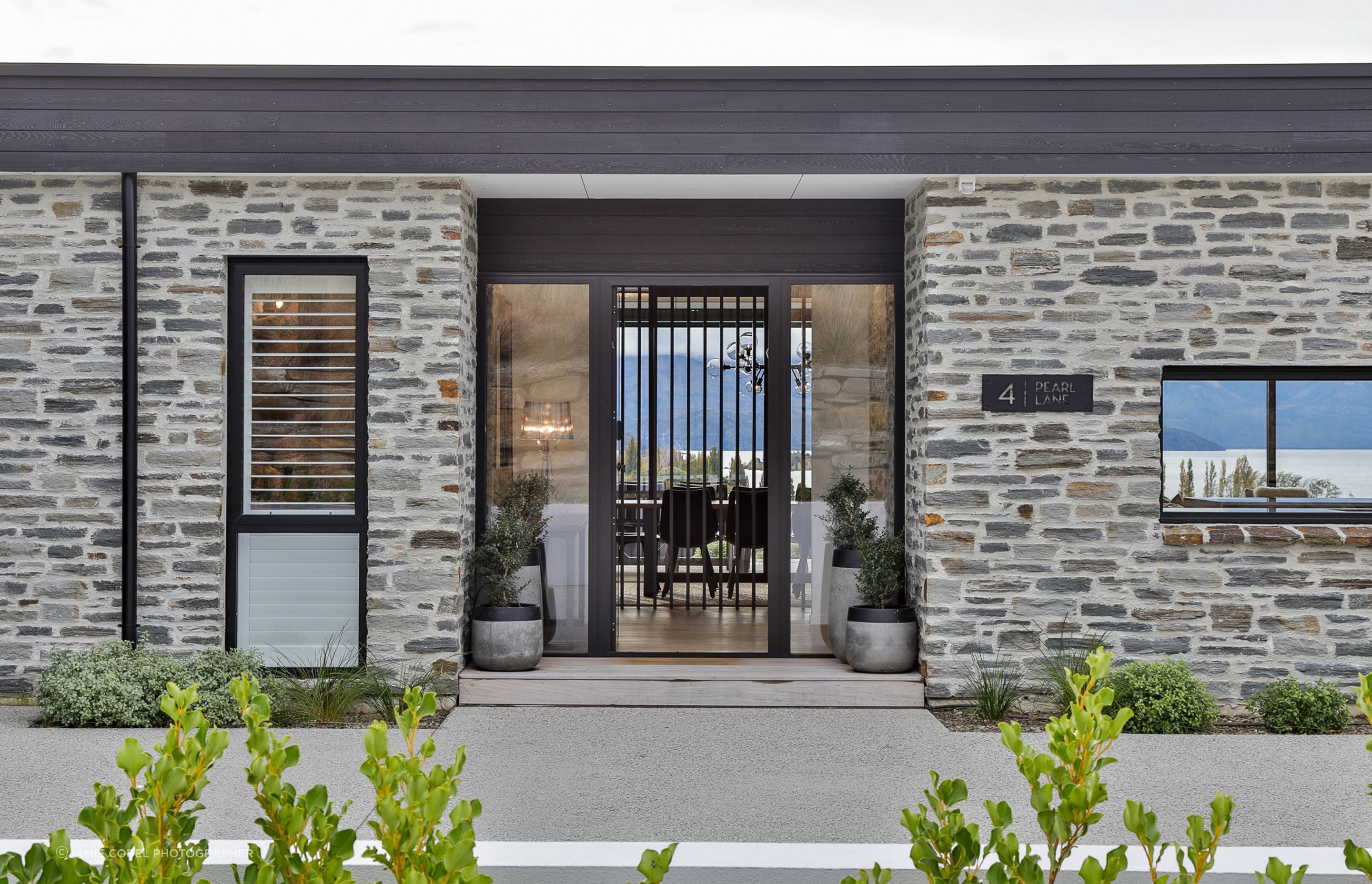 Schist exterior cladding and entrance.  Landscaping- by Tim at The Landscaper Wanaka.