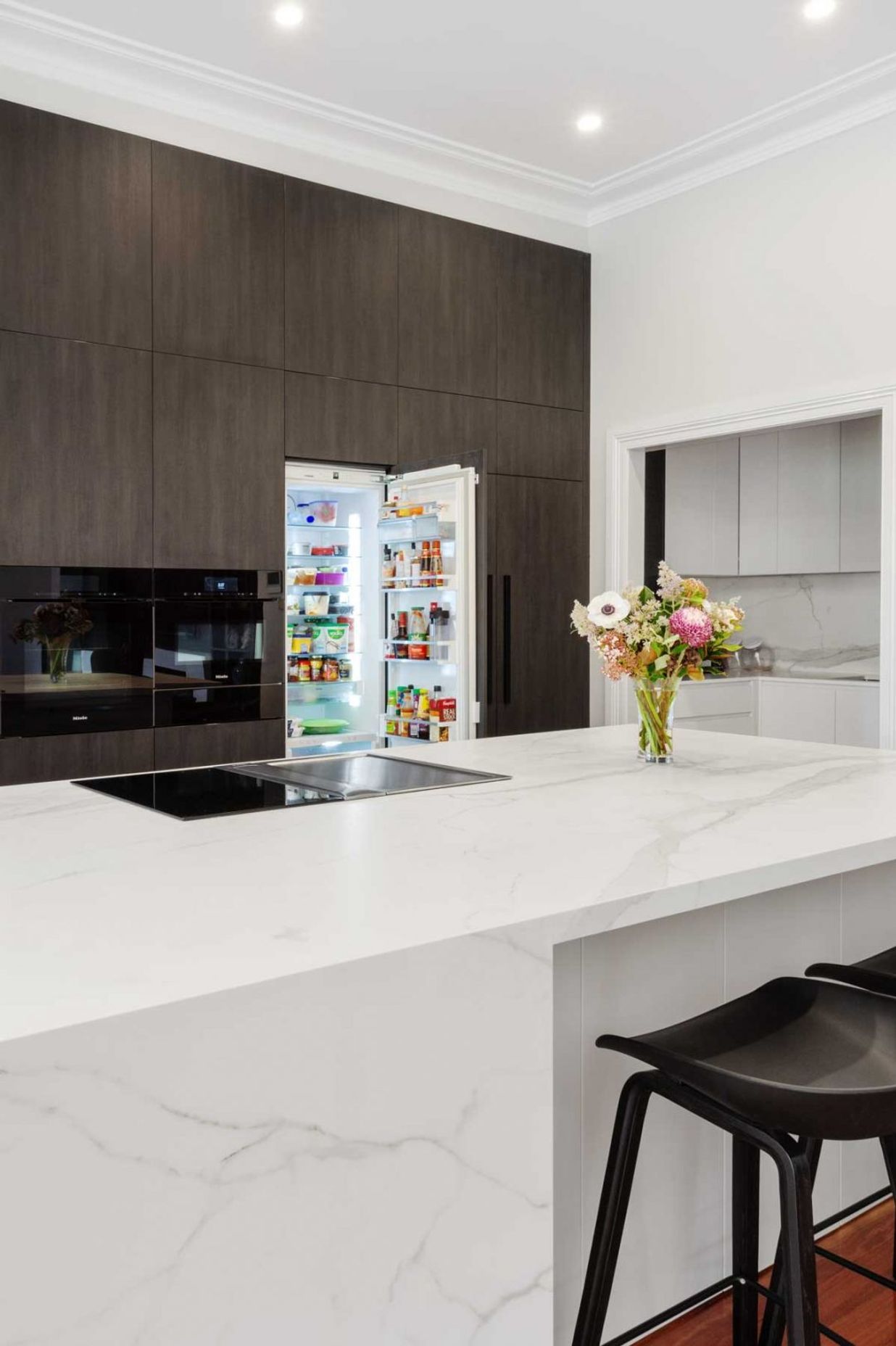 premier-kitchen-design-sydney-neolith-dekton-benchtop-splashback-integrated-fridge-1084x1626.jpg