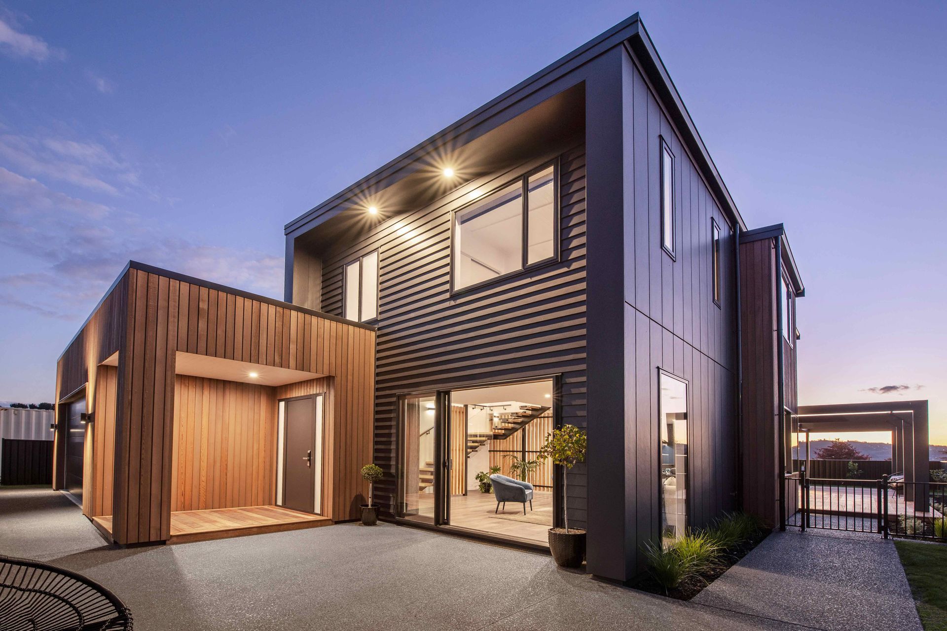 For the exterior, a mix of eye-catching materials was chosen, including vertical cedar, traditional weatherboards and Stria panels.