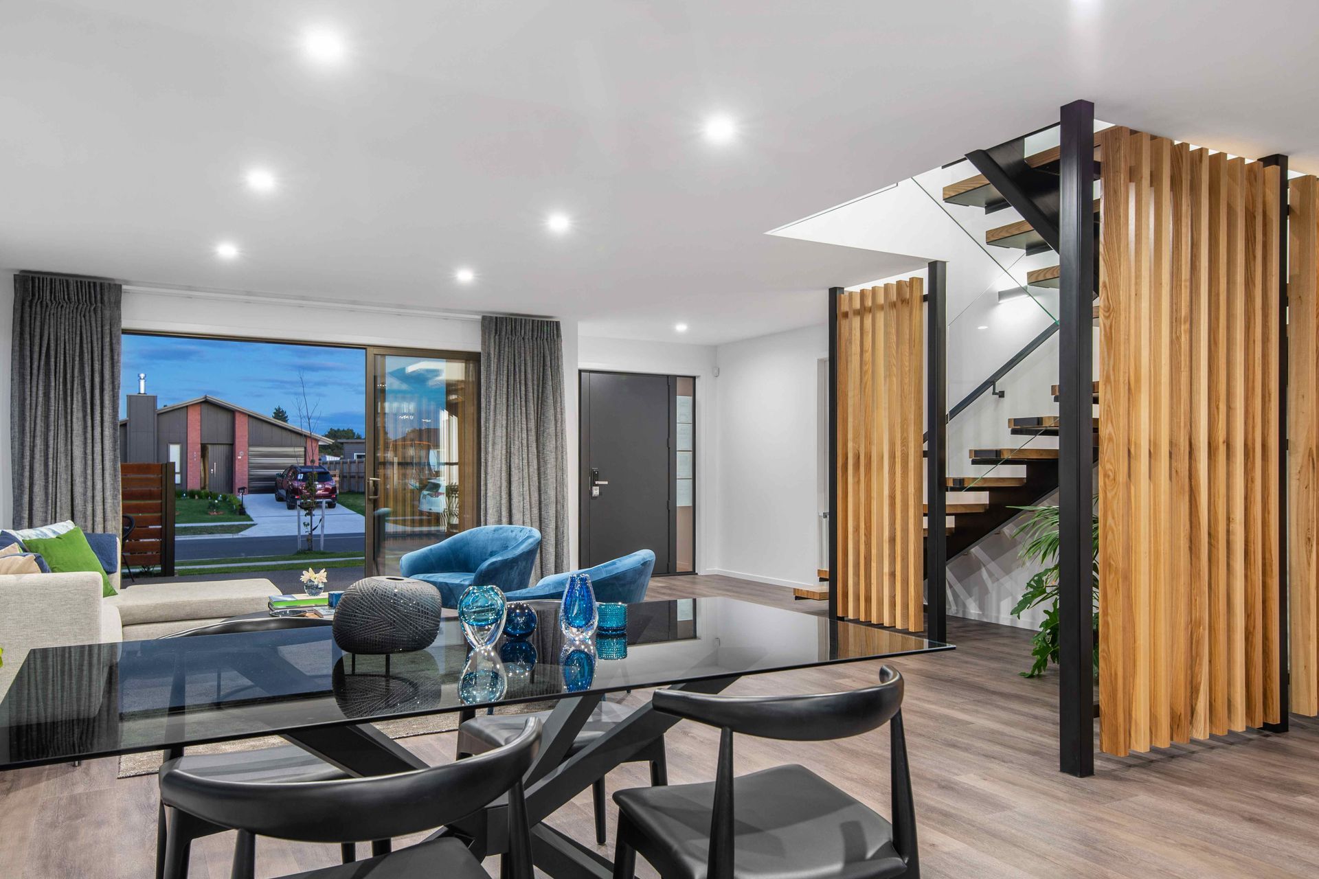 Inside, the material palette continues with strong timber accents and bold splashes of colour against a ‘black and white’ theme.