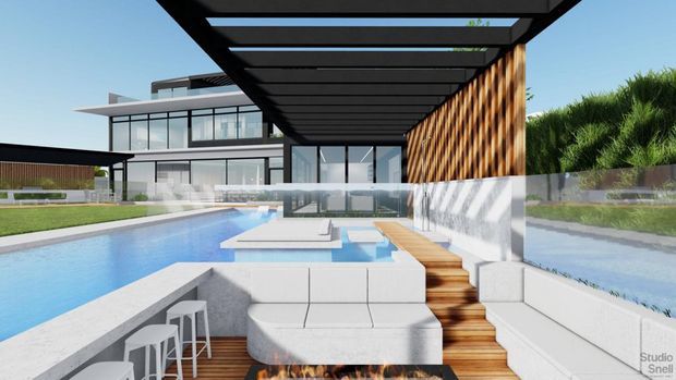 A contemporary residential outdoor entertaining area beside a swimming pool, featuring a covered pergola with exposed dark structural beams, built-in white seating, a sunken fire pit, a compact outdoor bar, timber decking and a textured timber feature wall. The pool and landscaped garden connect the terrace to a modern glass-fronted house.