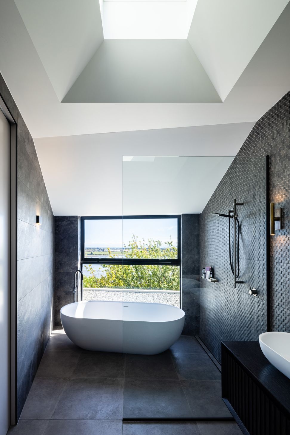 The master en suite bath and shower enjoy a dramatic view.