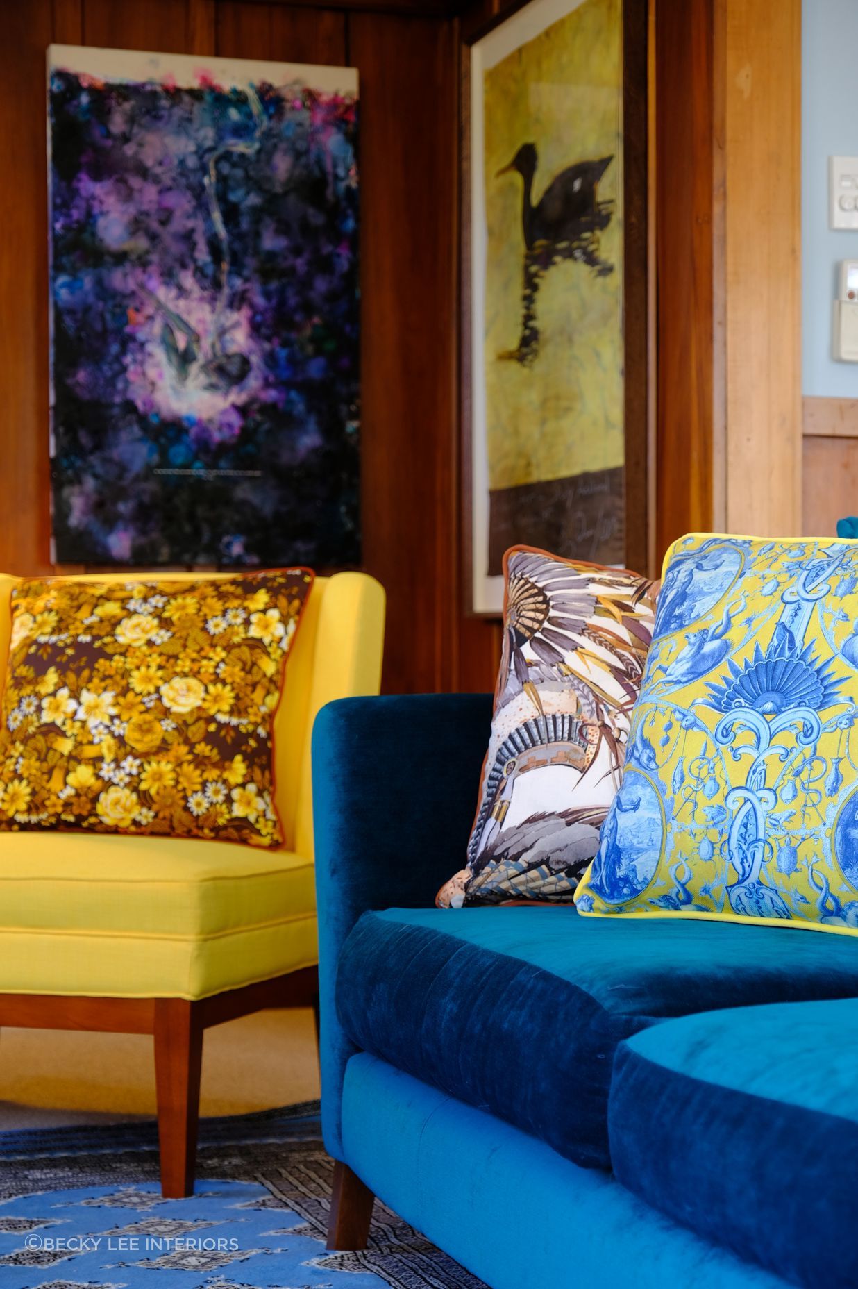 Repetition of colours in the space makes an unsuspecting combination of cushions work in this living room. Cushions available at beckylee.co.nz