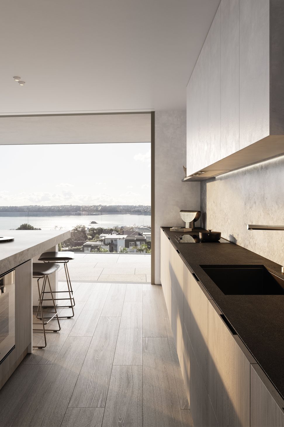 Kitchens are designed with custom-made cabinetry, state-of-the-art Gaggenau and Liebherr appliances, a honed marble island, and honed slate benchtops.