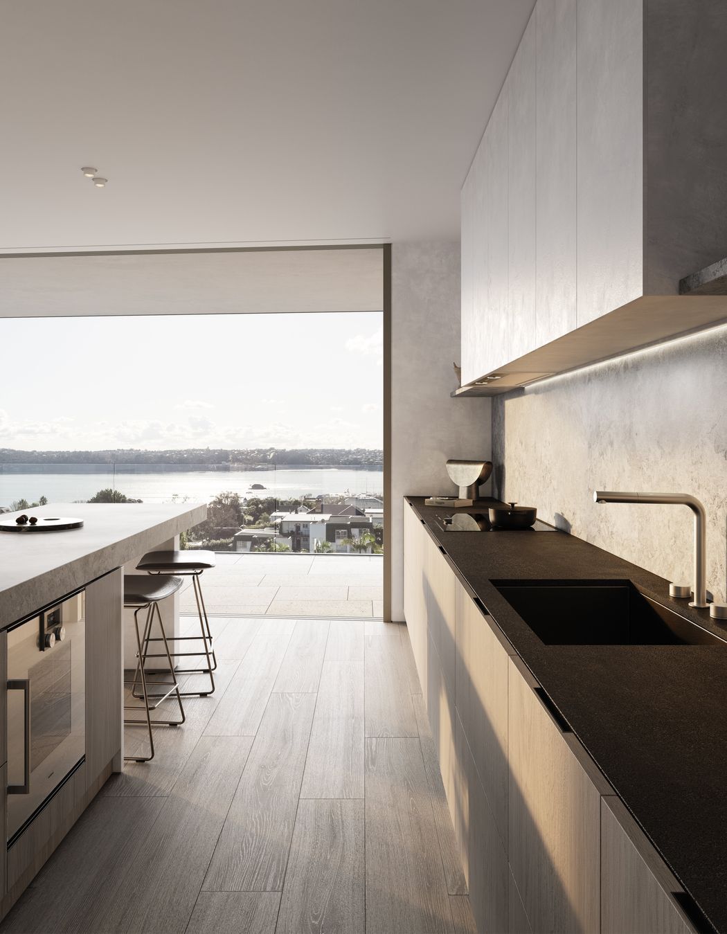 Kitchens are designed with custom-made cabinetry, state-of-the-art Gaggenau and Liebherr appliances, a honed marble island, and honed slate benchtops.