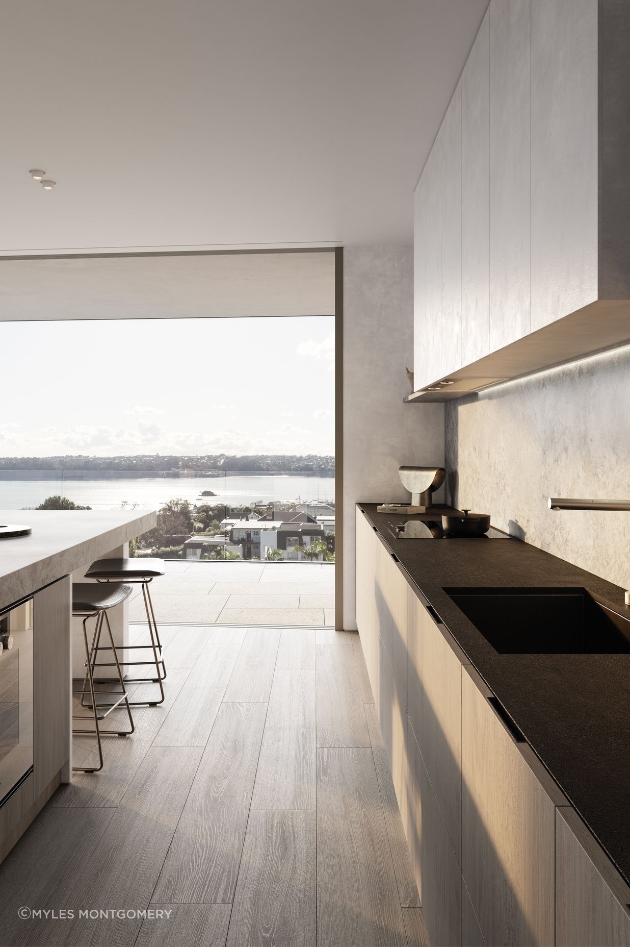 Kitchens are designed with custom-made cabinetry, state-of-the-art Gaggenau and Liebherr appliances, a honed marble island, and honed slate benchtops.