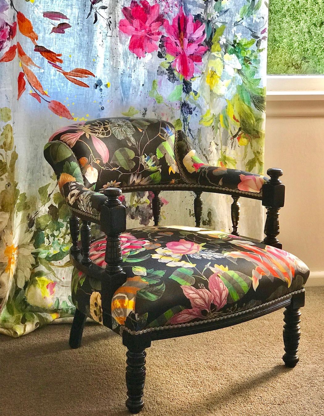 An heirloom Captains Chair was given a vibrant makeover with some black gloss lacquer and an edgy Christian Lacroix furnishing fabric.
