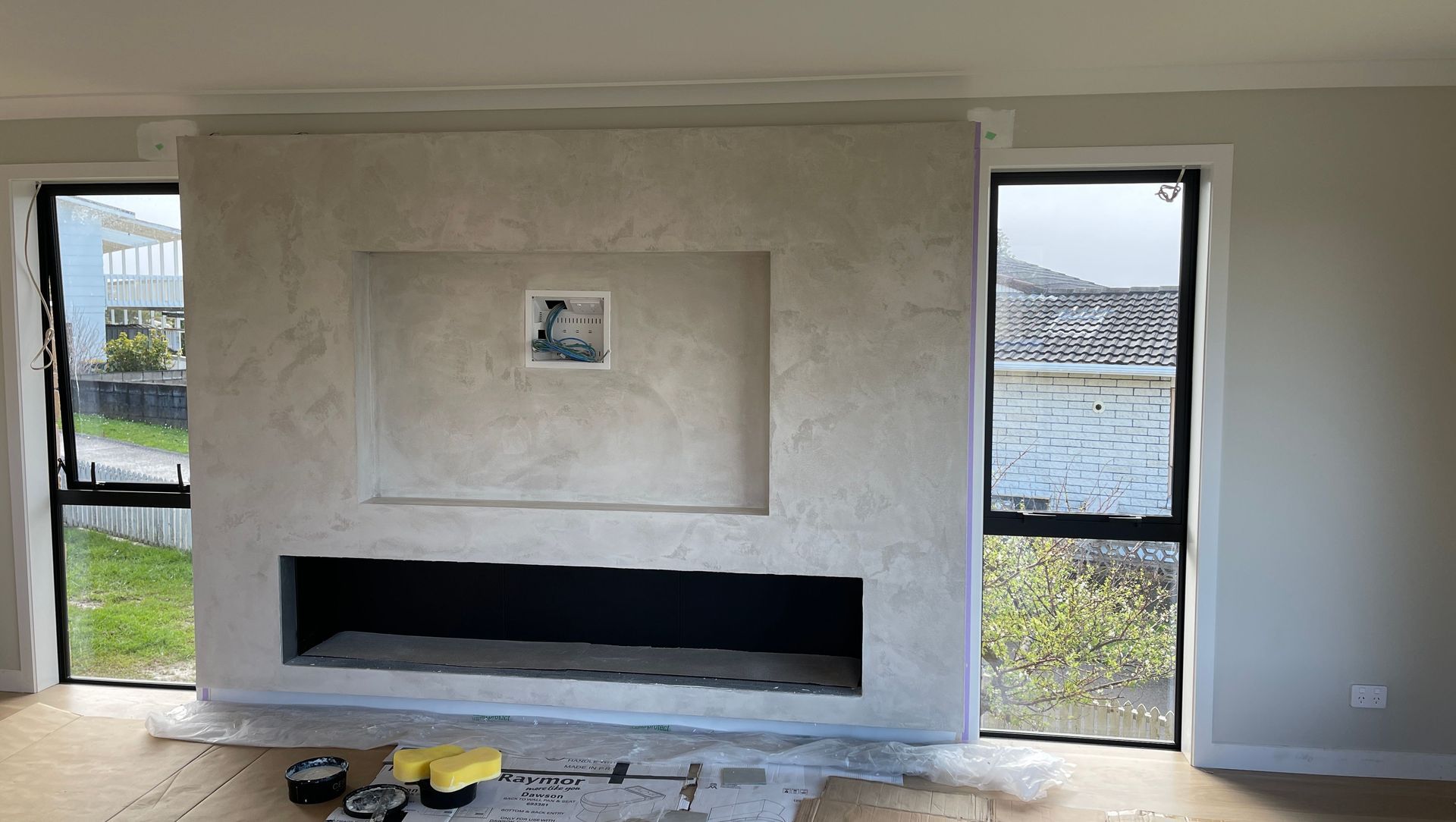 Resistone microcement fireplace banner