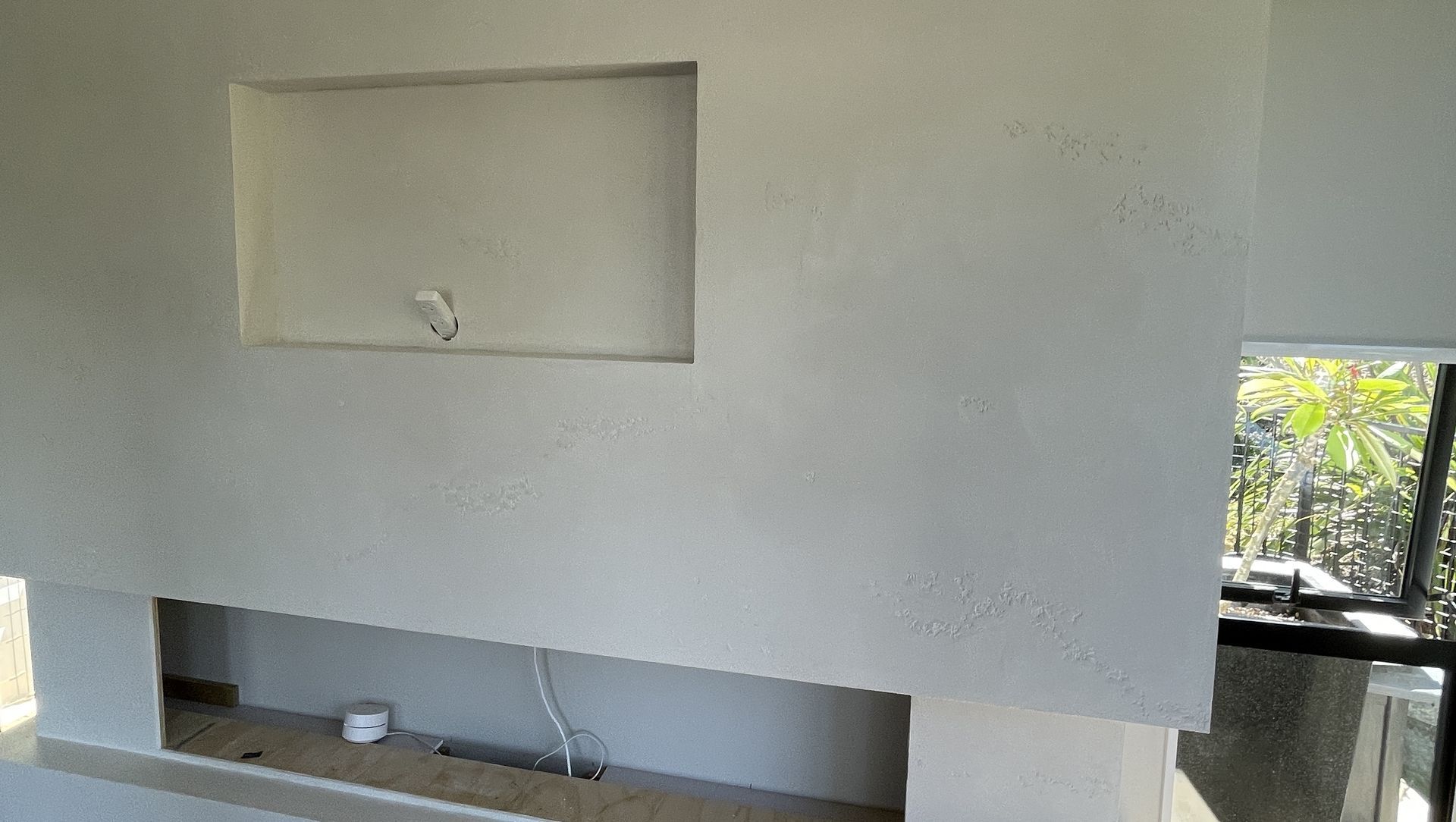 Resistone microcement fireplace banner