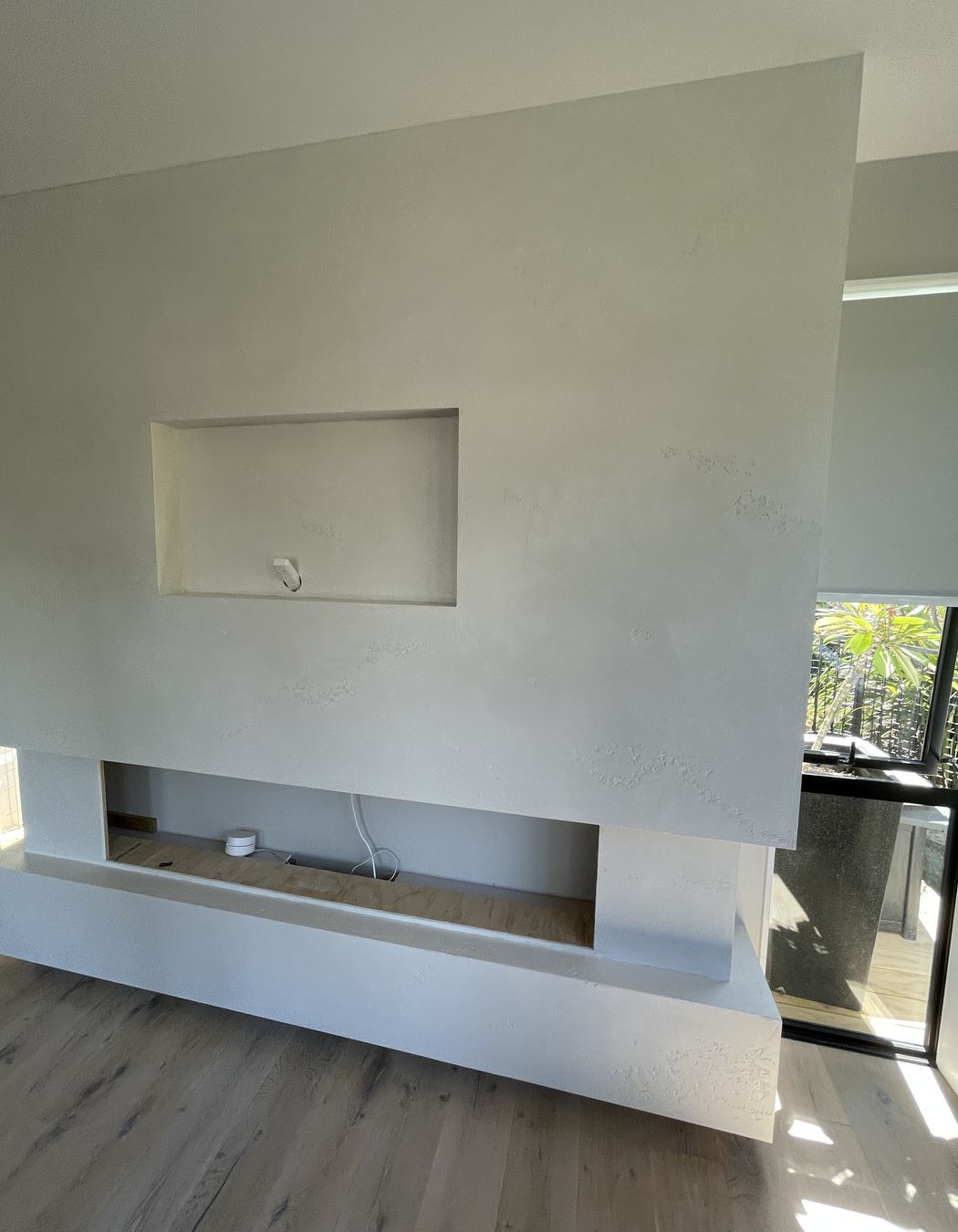 Resistone microcement fireplace