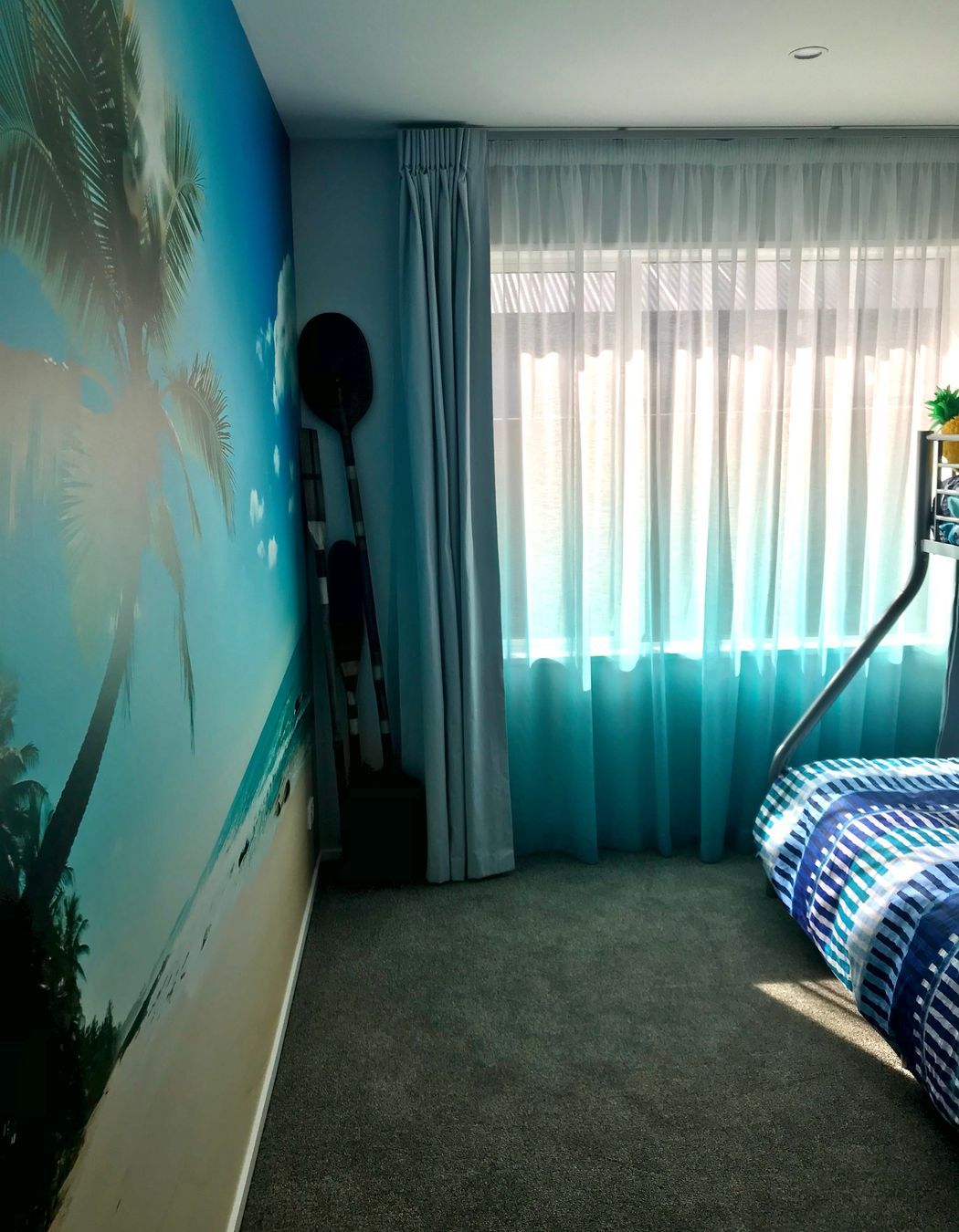 Boys bedroom... a double track system for the curtains with a dip dyed sheer doing the heavy lifting for privacy.