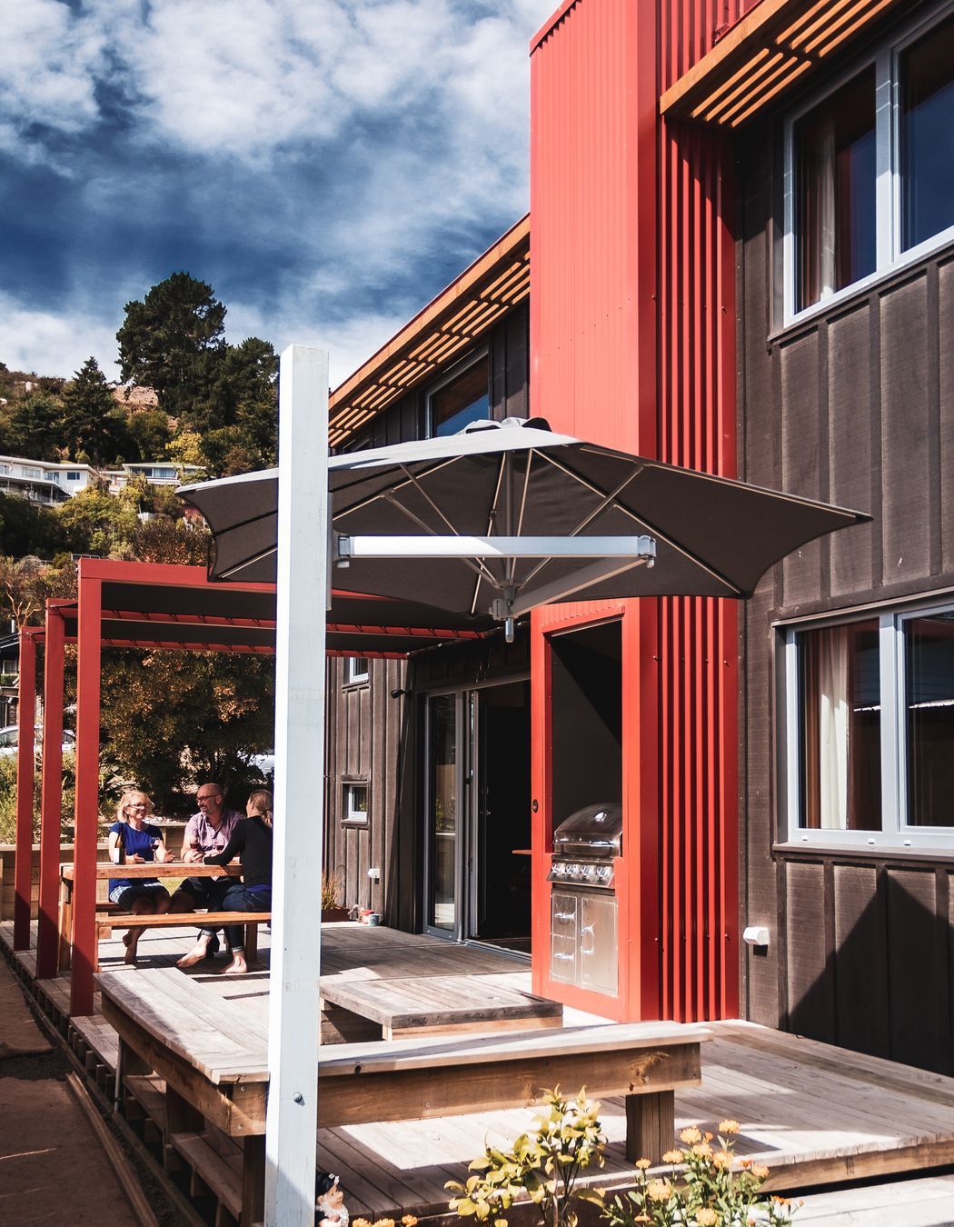 The traditional tramping hut fireplace is realised through the outdoor BBQ.