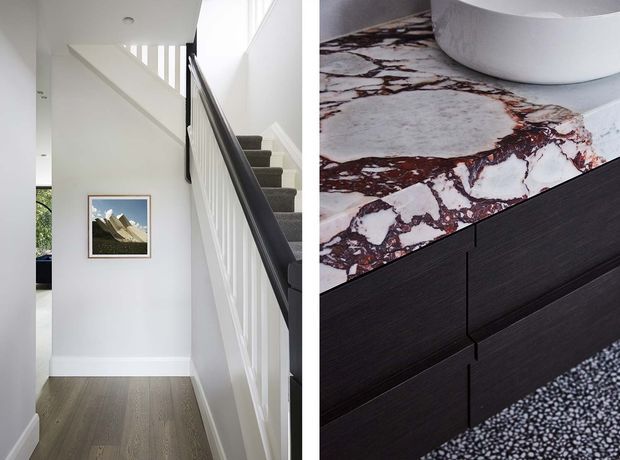 A split architectural interior image showing a bright residential stairway with white walls, a dark timber handrail, white balusters, grey carpeted stairs, and timber flooring. The adjacent detail shows a bathroom vanity with dark wood cabinetry, a dramatic burgundy-veined marble benchtop, and a white vessel basin.