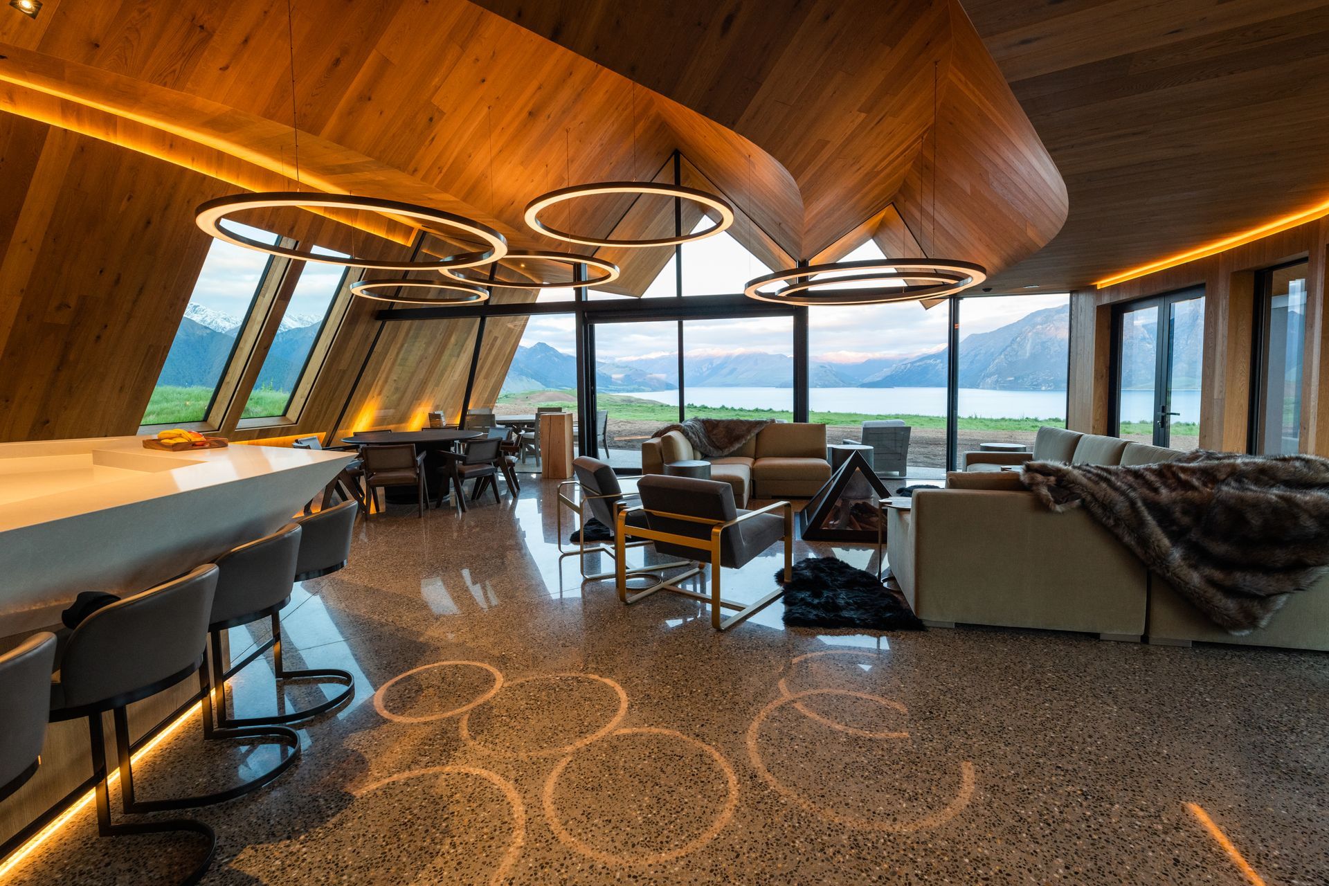 The interior material palette has been kept to a minimum—just concrete floors, engineered timber flooring on the walls and ceiling, American oak cabinetry and Caesarstone surfaces in the kitchen.