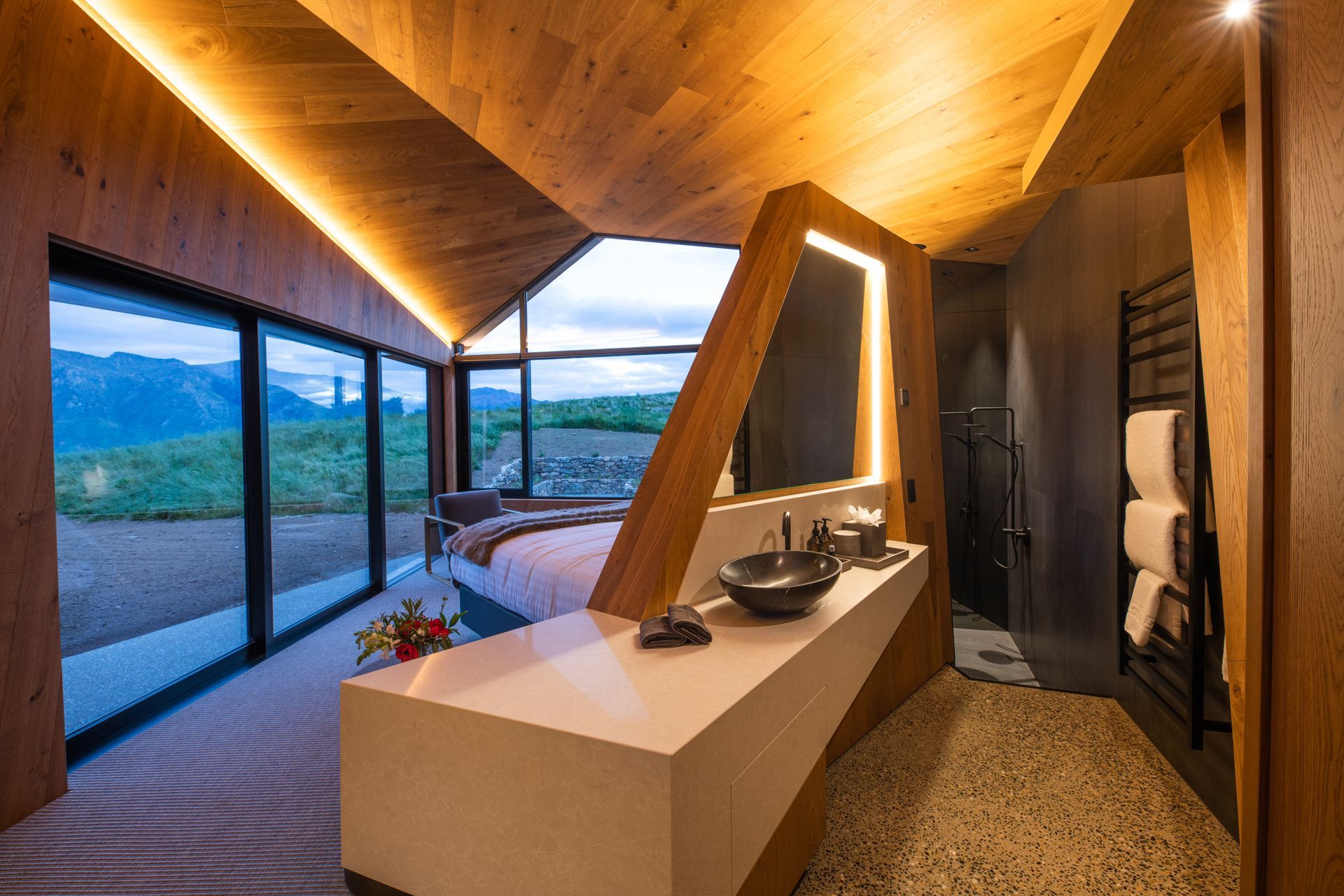 Ensuite bathrooms have been cleverly incorporated into the bedroom suites so that they too can take advantage of the views.