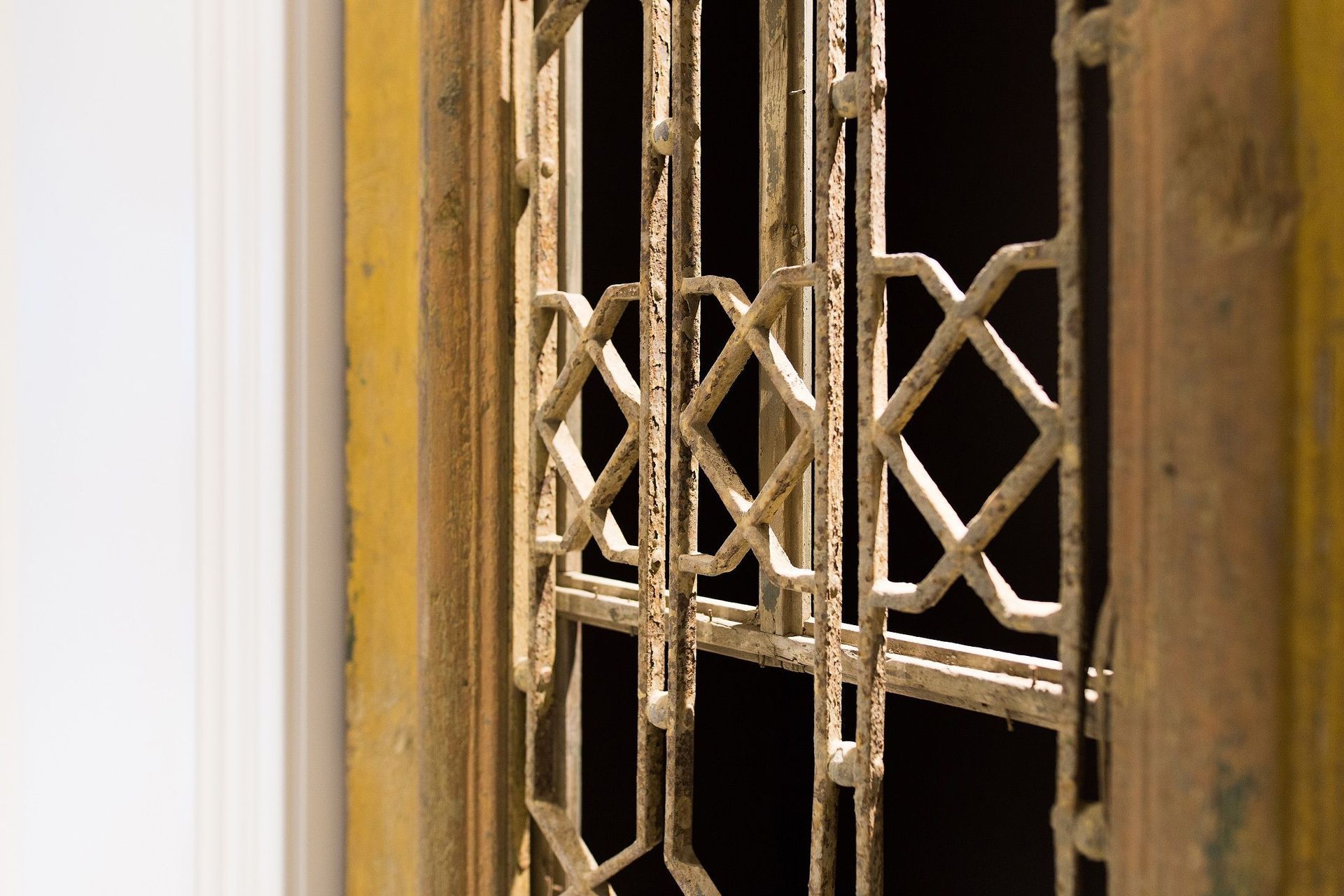 A pair of antique Egyptian villa doors adds a unique touch to the interior, imparting a sense of patina in an otherwise pared-back and refined scheme.