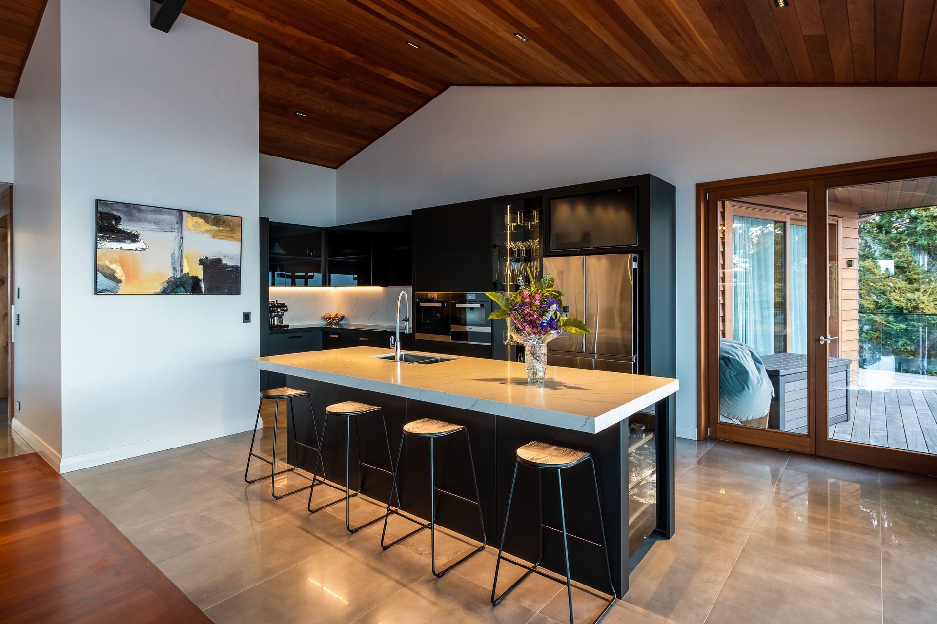 The ovens in the kitchen are by Miele and the fridge is by Samsung. With a glassware display cabinet, two dishwashers and a Vintec wine fridge, it's a house made for entertaining.