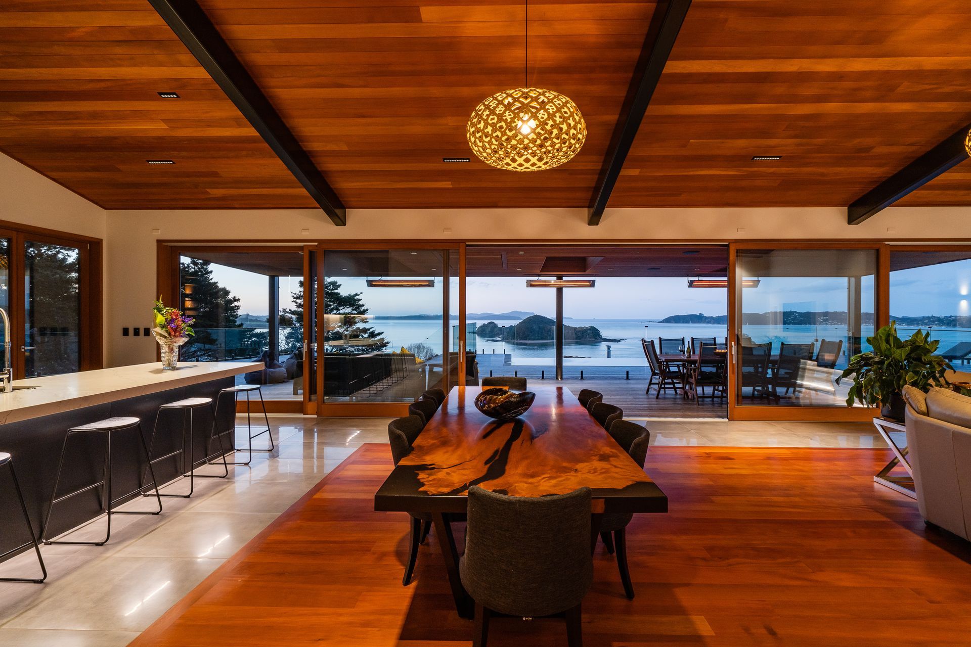 The wood for the inlay floor was sourced by the homeowner. The 13.5m doors were custom made by Optimal Windows. “They slide beautifully,” says Alan. On the ceiling are pinpoint Laser Blade downlights by iGuzzini that reduce glare.