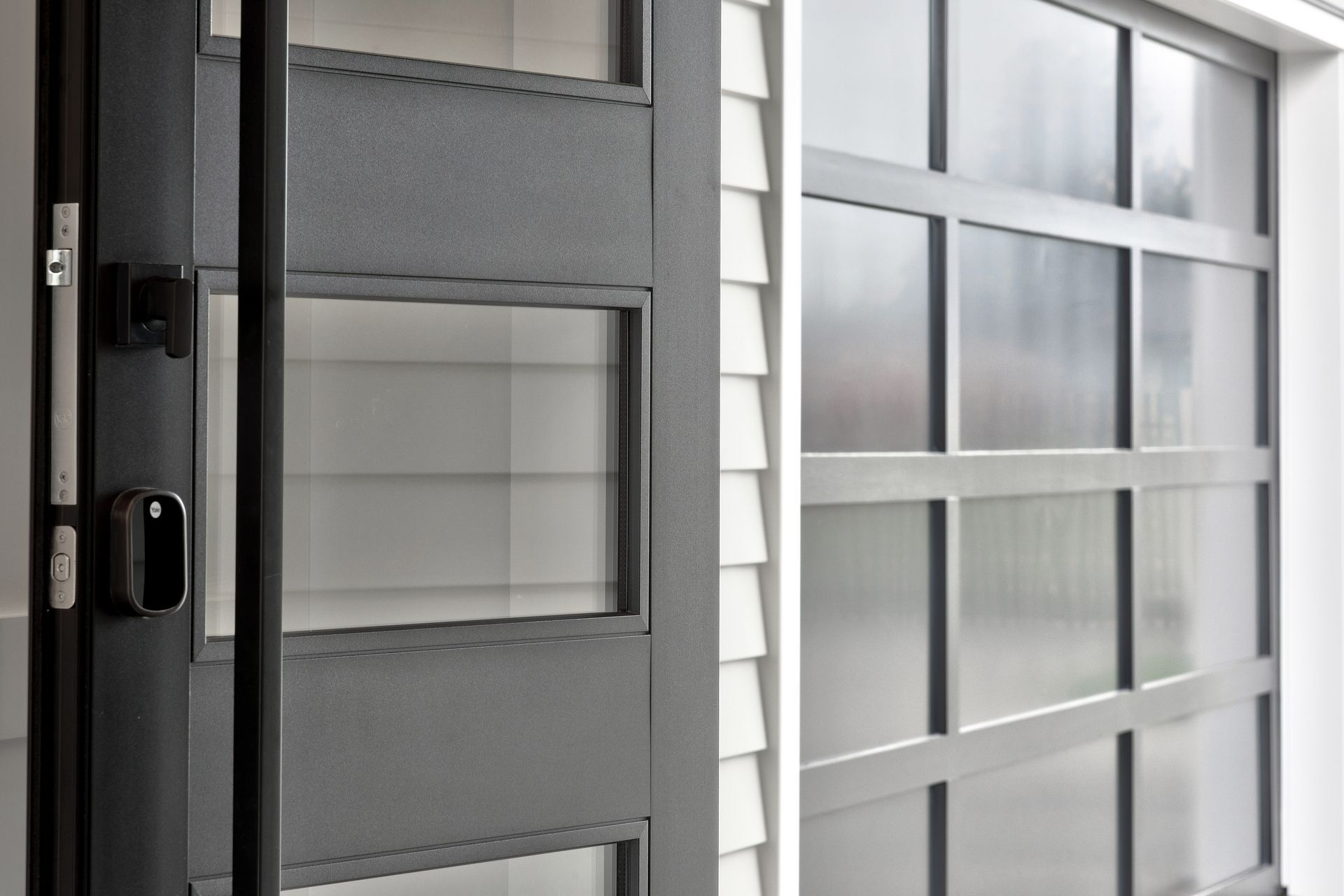 The materiality of weatherboard contrasting against metal, and dark against light, is an elegant juxtaposition.