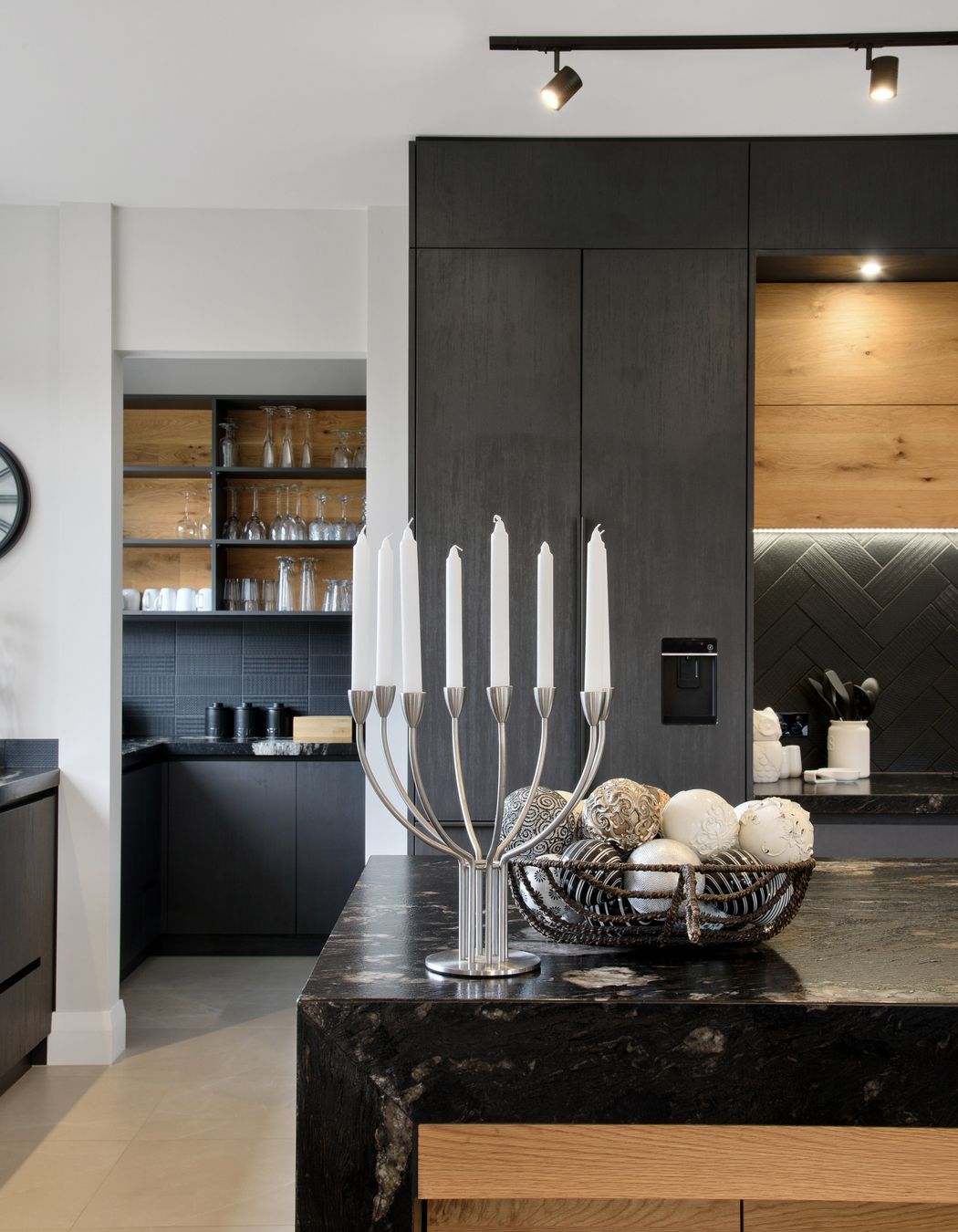 Behind the kitchen a luxurious scullery hides all of the mess.