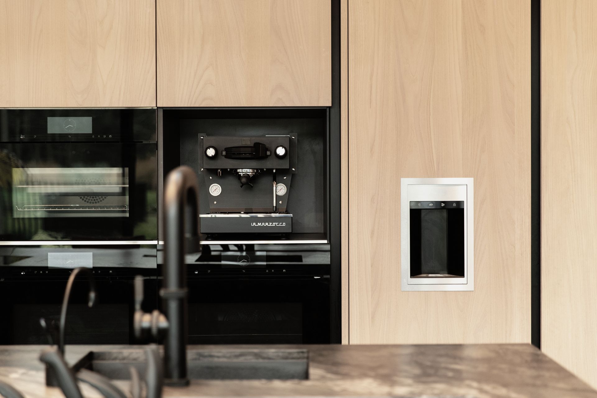 The sleek La Marzocco Mini sits perfectly in its space