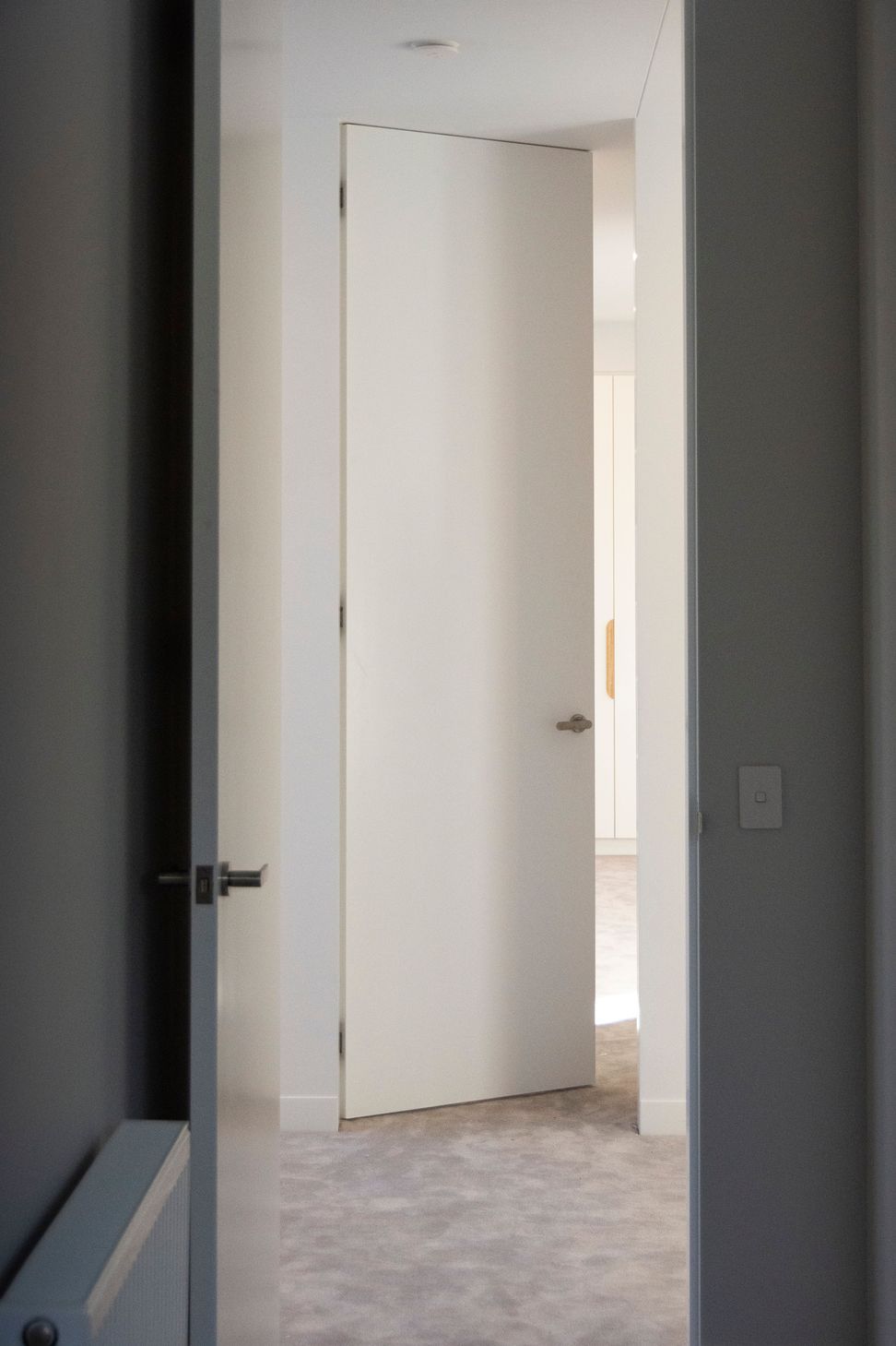 Double symmetrical photos Two bedrooms leading through to one another across the hallway; both are EzyJamb SRC openings.