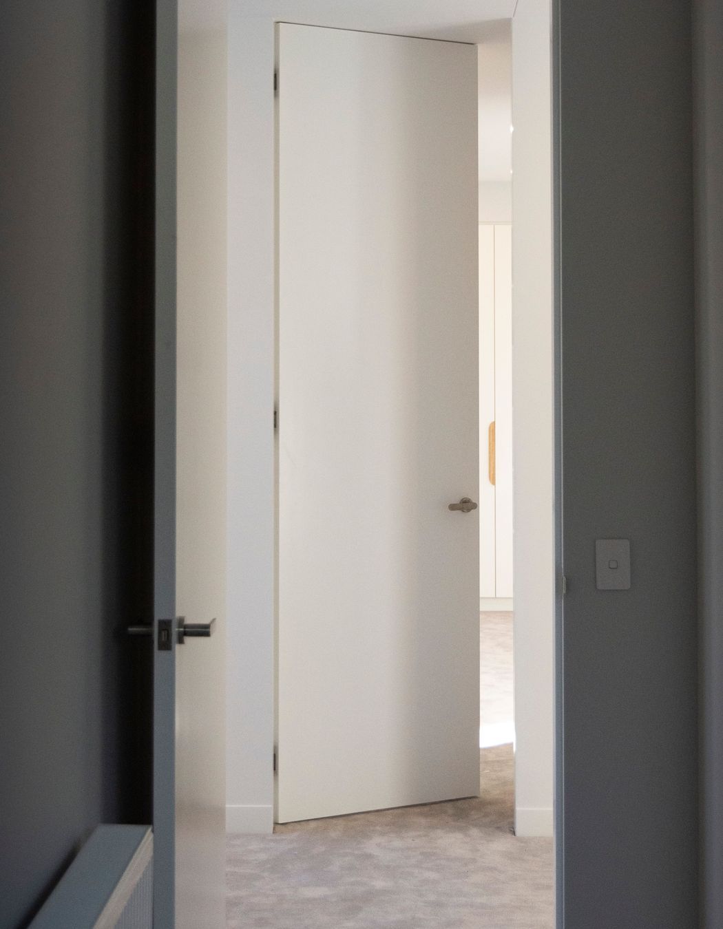 Double symmetrical photos Two bedrooms leading through to one another across the hallway; both are EzyJamb SRC openings.