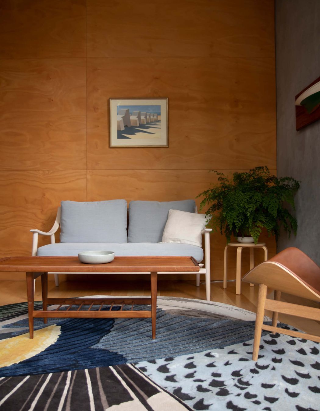 Marino Sofa by Ercol, The Orange Armchair by Warm Nordi, Feathers Rug by CC-Tapis