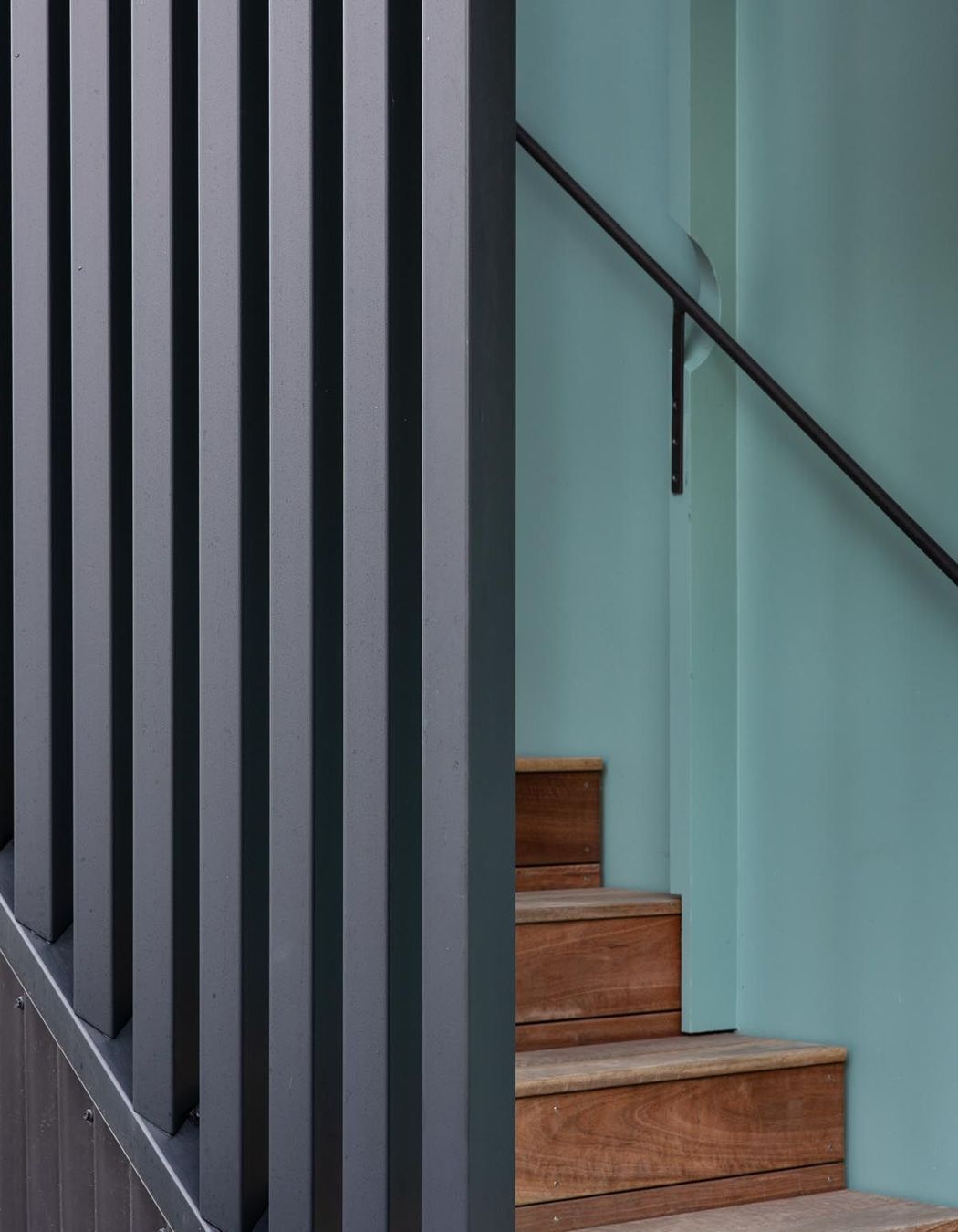 “We used the battens on the stairwell wall to run the handrail through small circular cutouts. The idea just popped out of my head at one point. It can be tricky to know how to do your brackets for the handrails.”