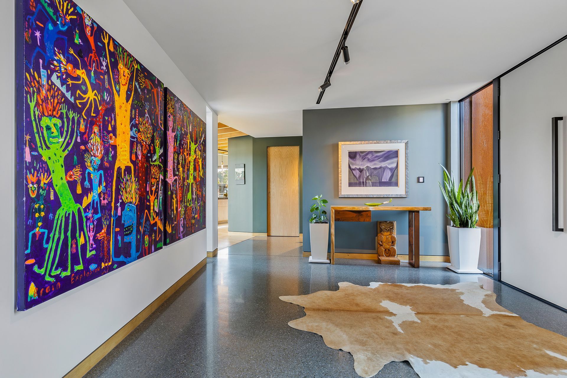 The entrance showcases the family's art collection.