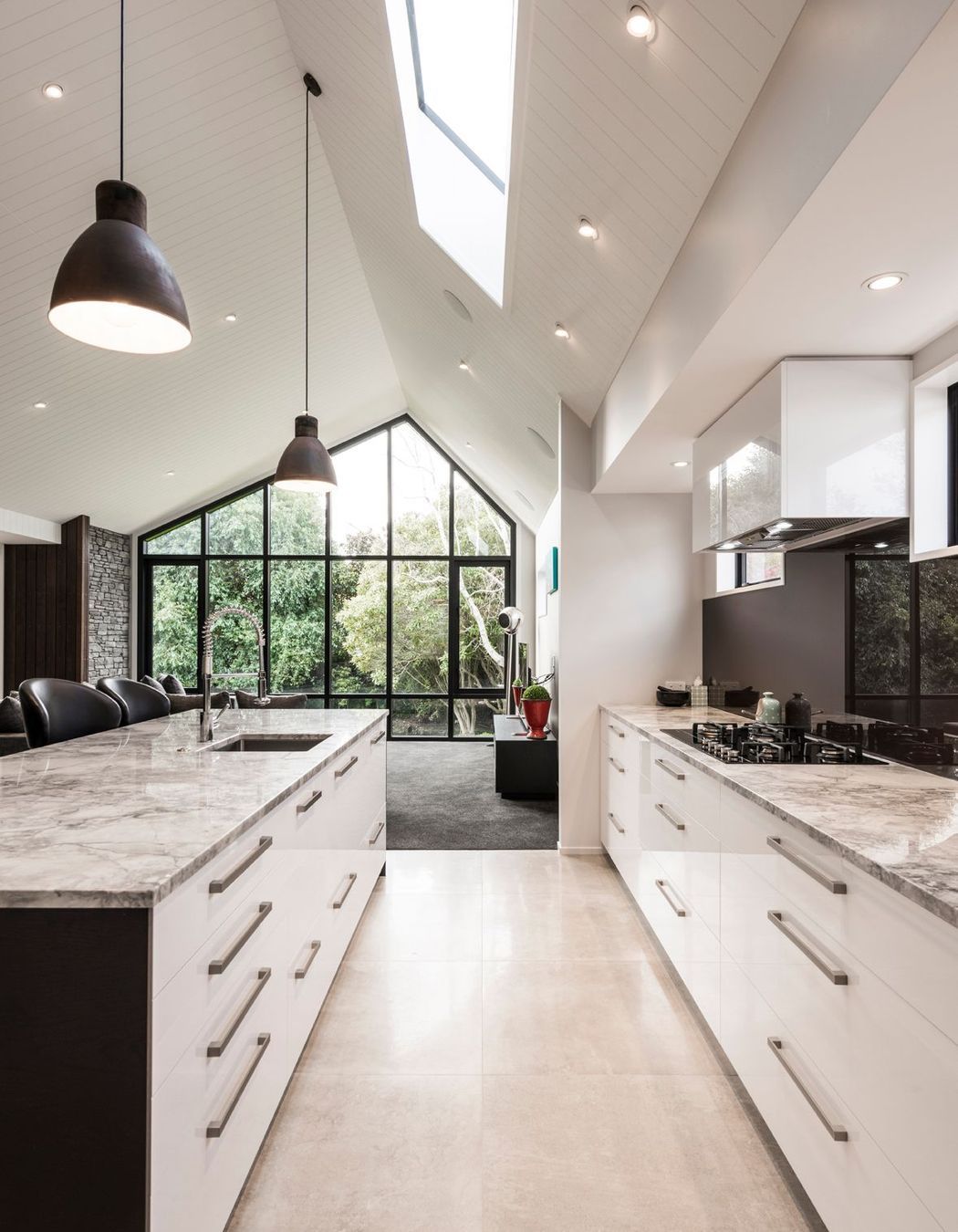 Due to height restrictions, an asymmetrical pitched roof means the apex is as high as possible to create as sense of grandeur.