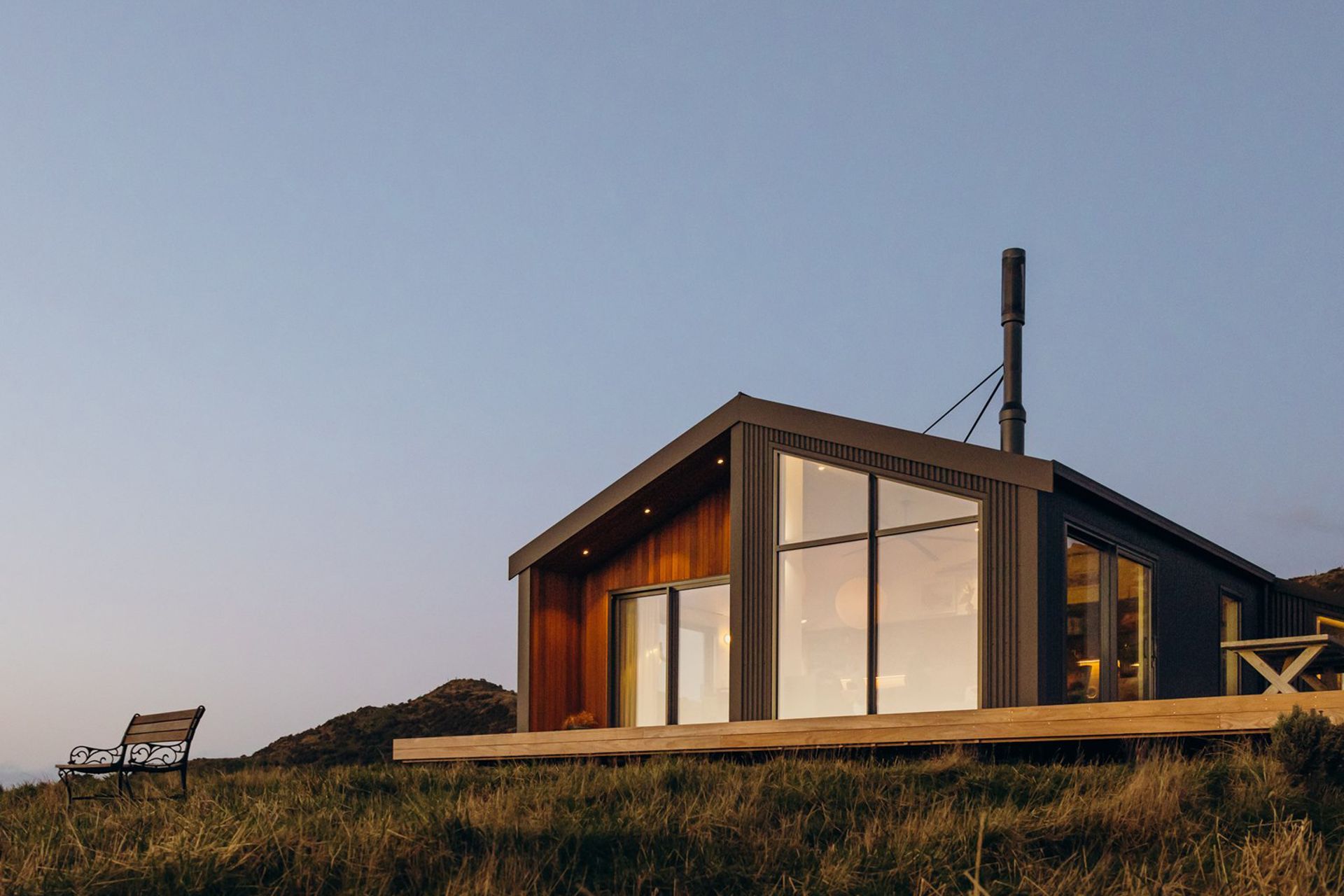 Perched 415 meters above sea level on Wellington south coast, this thoughtfully designed 190 square meter home commands sweeping views across the Cook Strait while offering a refined balance of comfort, resilience and environmental sensitivity. Purpose-built to to withstand the region's dramatic weather conditions, this home is as much a shelter as it is a statement in understated, sustainable living.