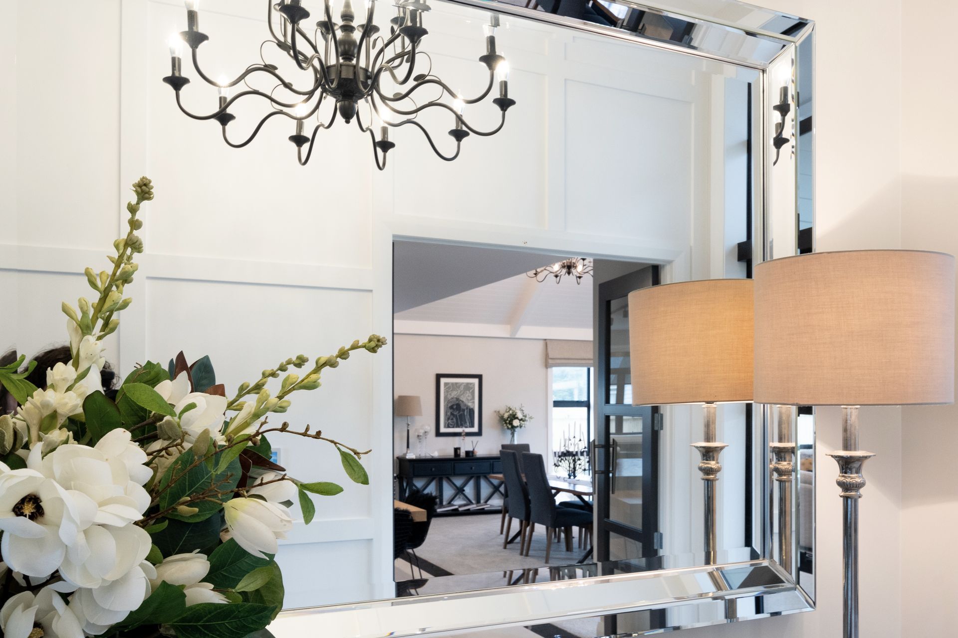 Opulent details such as chandeliers and mirrors elevate the interior spaces.