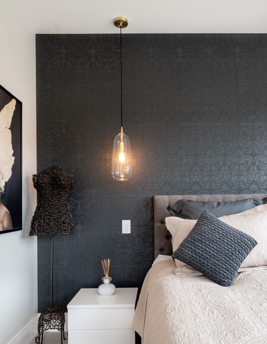 Carefully chosen wallpaper from Tobin is an artful addition to this bedroom.