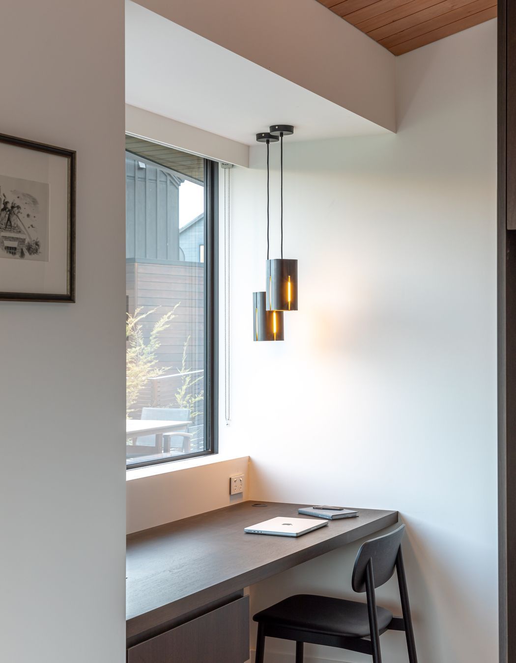 Pendant by Odd Thing Made lights the study space