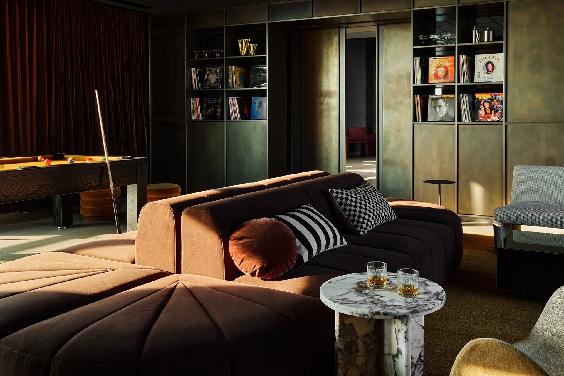 Pictured: Amara Curve Side Table, Juno Channel Modular Sofa, Kennedy Ribbed Round Ottoman