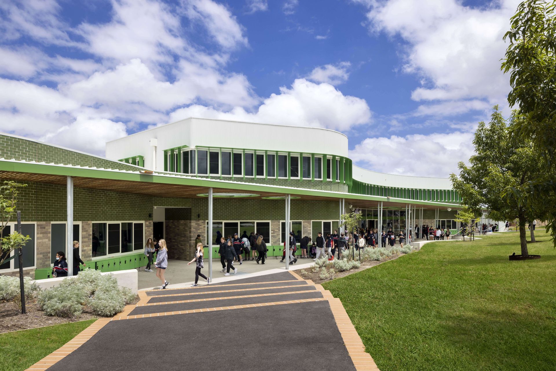 The beautifully curved Brick Inlay facade features Krause Rustic Grey brick tiles and Green glazed brick tiles