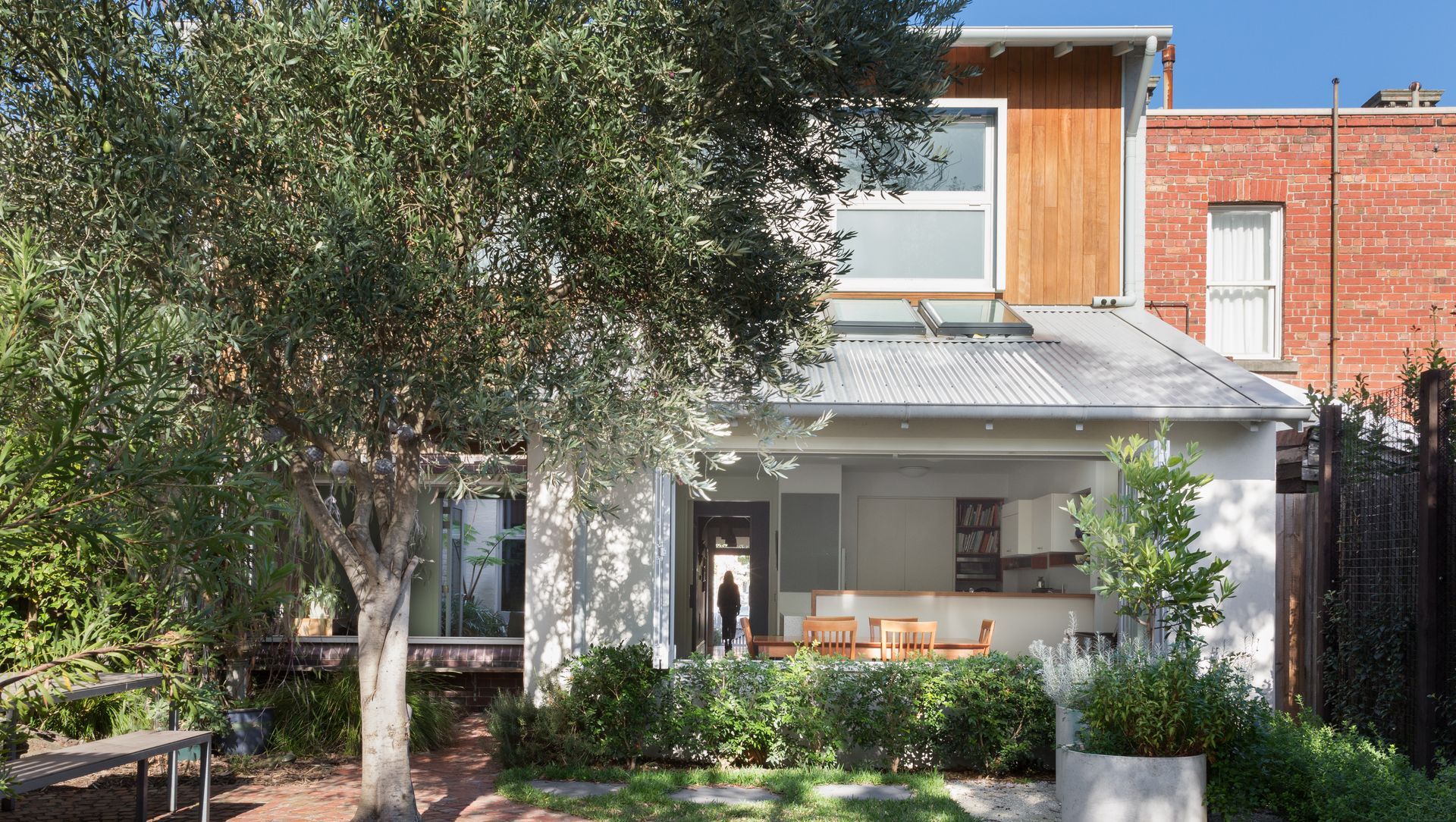 View from the garden through the living room to the courtyard