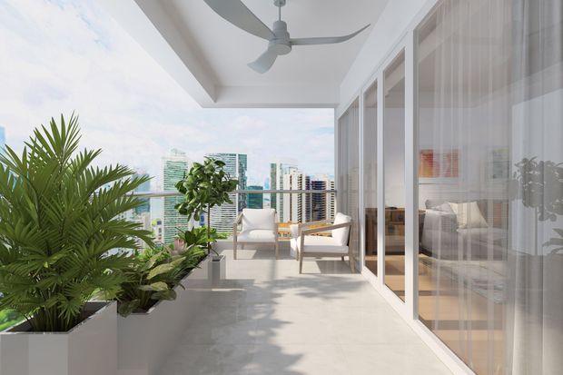 Bright contemporary high-rise balcony terrace with pale tiled flooring, large white planters containing lush tropical foliage, and two light lounge chairs around a small table. Full-height glazed doors with sheer curtains open onto the terrace, while a ceiling fan and expansive city skyline reinforce the airy outdoor living setting.