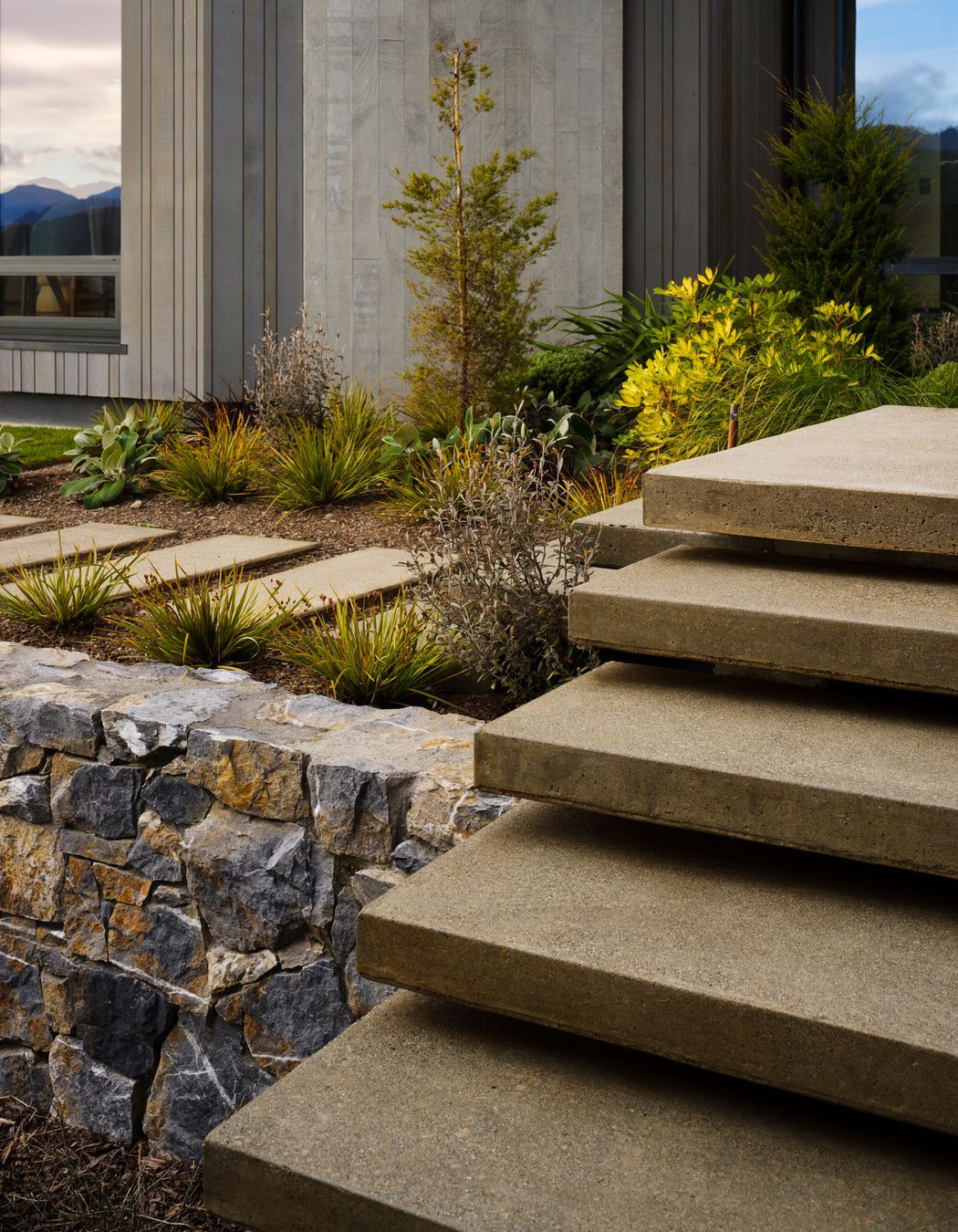The landscaped terraces, with their rock faces spilling up and around the building, create a series of big gestures that impart a sense of the landscape merging into the environment.