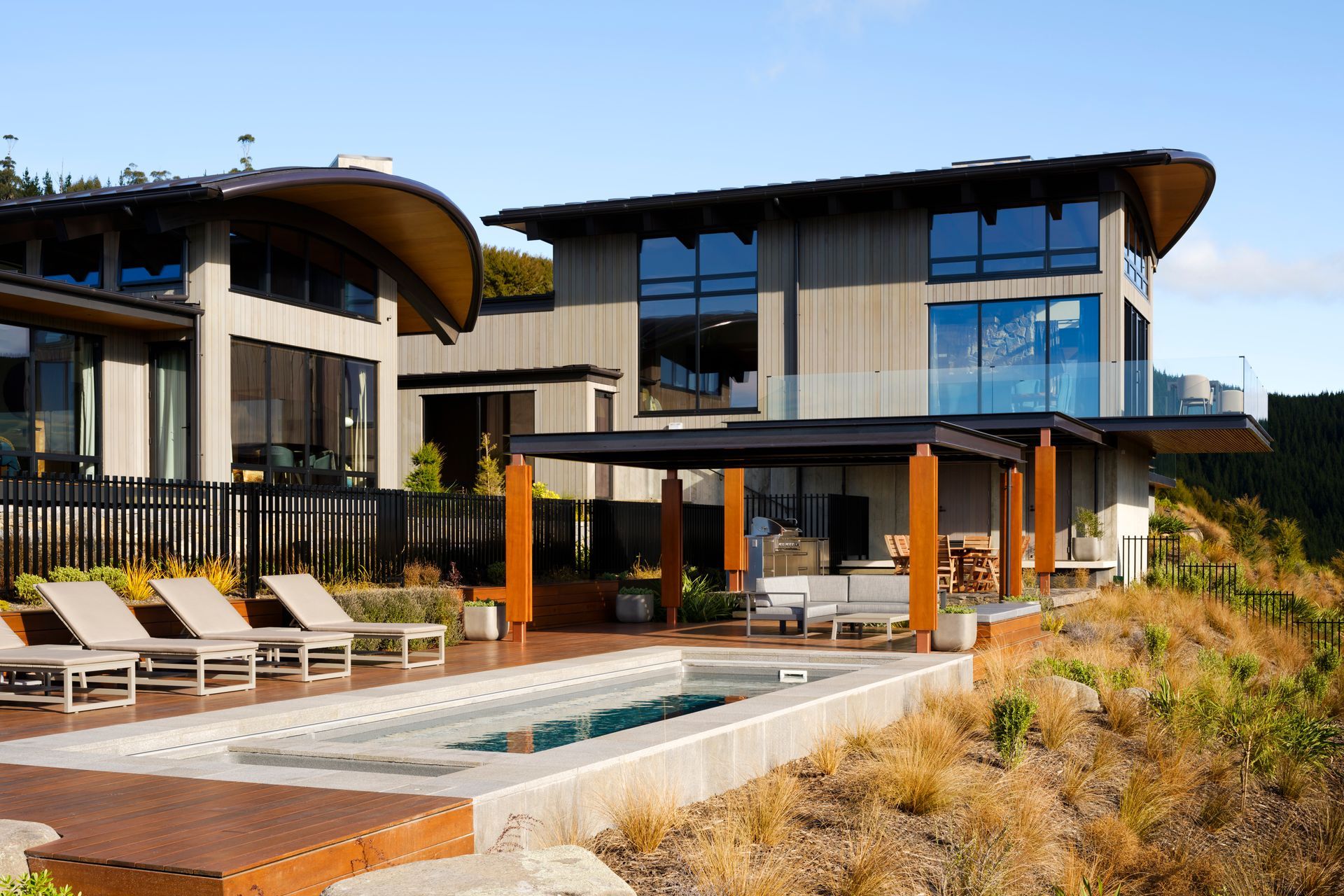 Satin black, slim-profile pool fencing provides security without impeding sightlines.