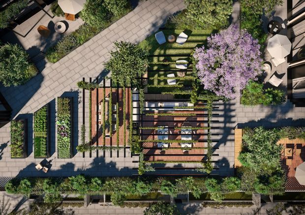 Aerial view of a highly designed landscaped outdoor space with geometric paved walkways, planted garden beds, timber pergola structures, lawn seating areas, mature trees, and multiple outdoor dining and lounge settings. The composition emphasizes a structured courtyard or rooftop-style garden with strong linear patterns and lush planting.